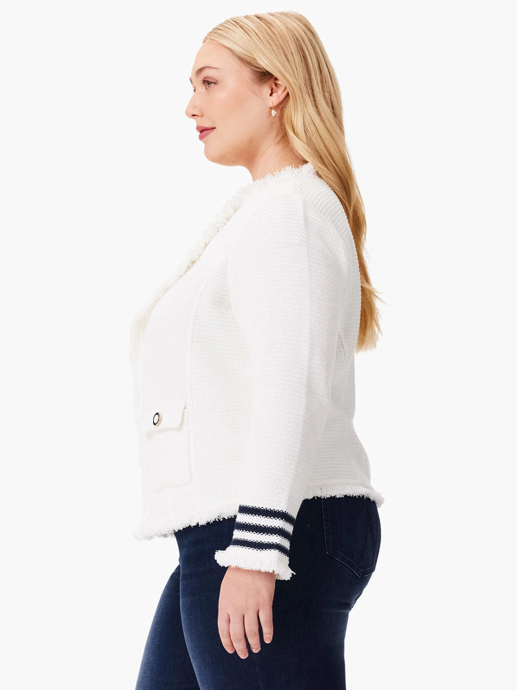 Off-white fringe knit jacket with navy blue stripes on cuffs. Fringe detail at hem and neckline.
