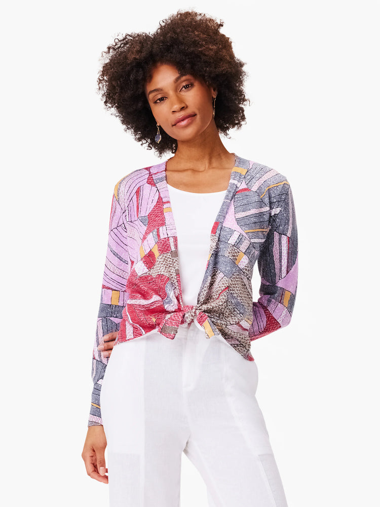 4-way cardigan; purple, red, gray, and beige abstract floral mosaic print. Front ties at waist. Long sleeves.