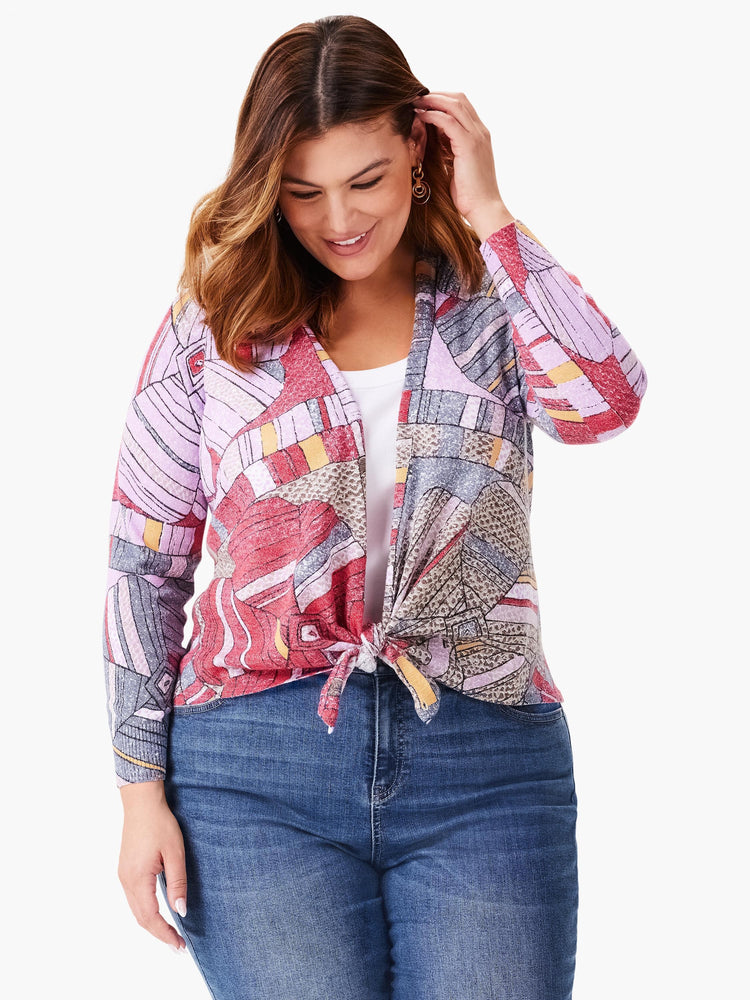 4-way cardigan with multicolored floral mosaic pattern in pinks, purples, grays, and yellows. Front ties at waist.