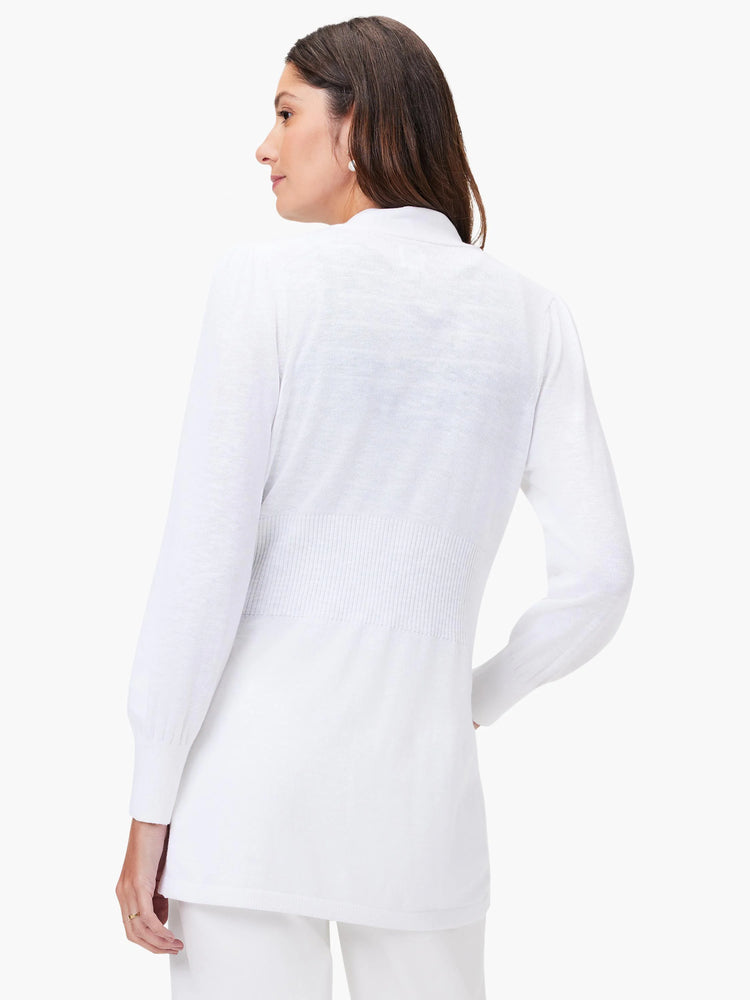 White knit cardigan, long sleeves, fitted waist. Back view.