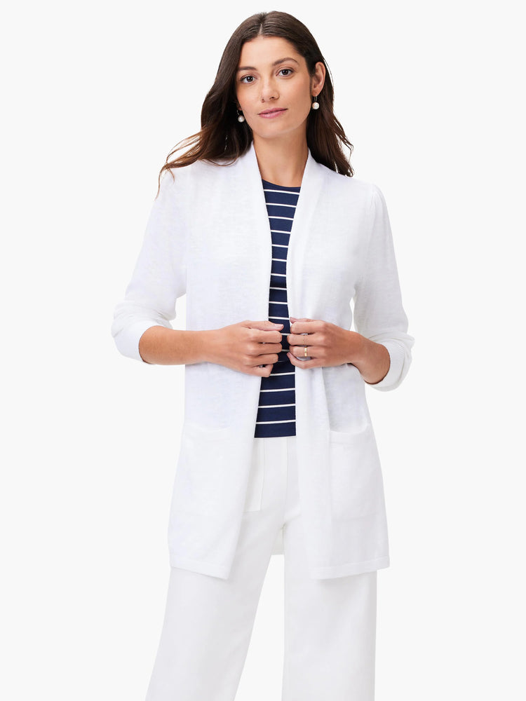 White open cardigan, long sleeves, patch pockets.