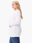 White cardigan, long sleeves,  subtle vertical seam detail down the back.  Has pockets.