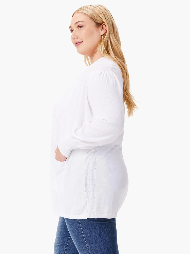 White cardigan, long sleeves, subtle vertical seam detail down the back. Has pockets.