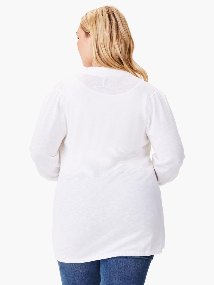 White knit cardigan, three-quarter sleeves, slightly fitted. Rear view.
