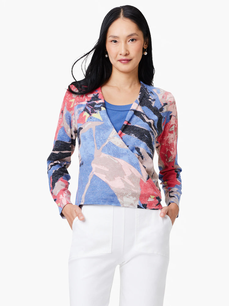 4-way cardigan in blue, pink, red, & black abstract print. Long sleeves, wrap style.