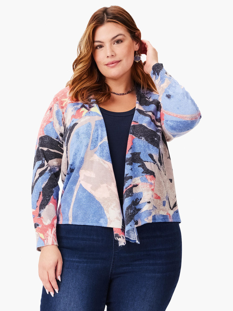 Abstract print 4-way cardigan. Blues, pinks, grays, and blacks. Open front, long sleeves.