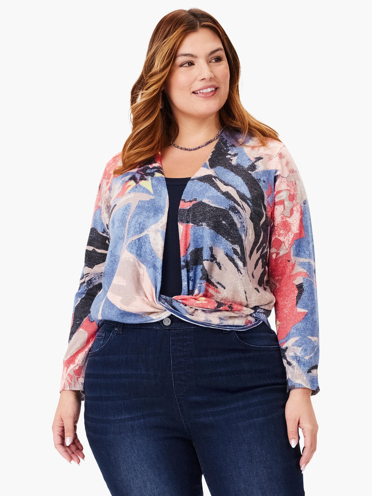 4-way cardigan with abstract blue, pink, coral, and gray print. Front knotted. Long sleeves.