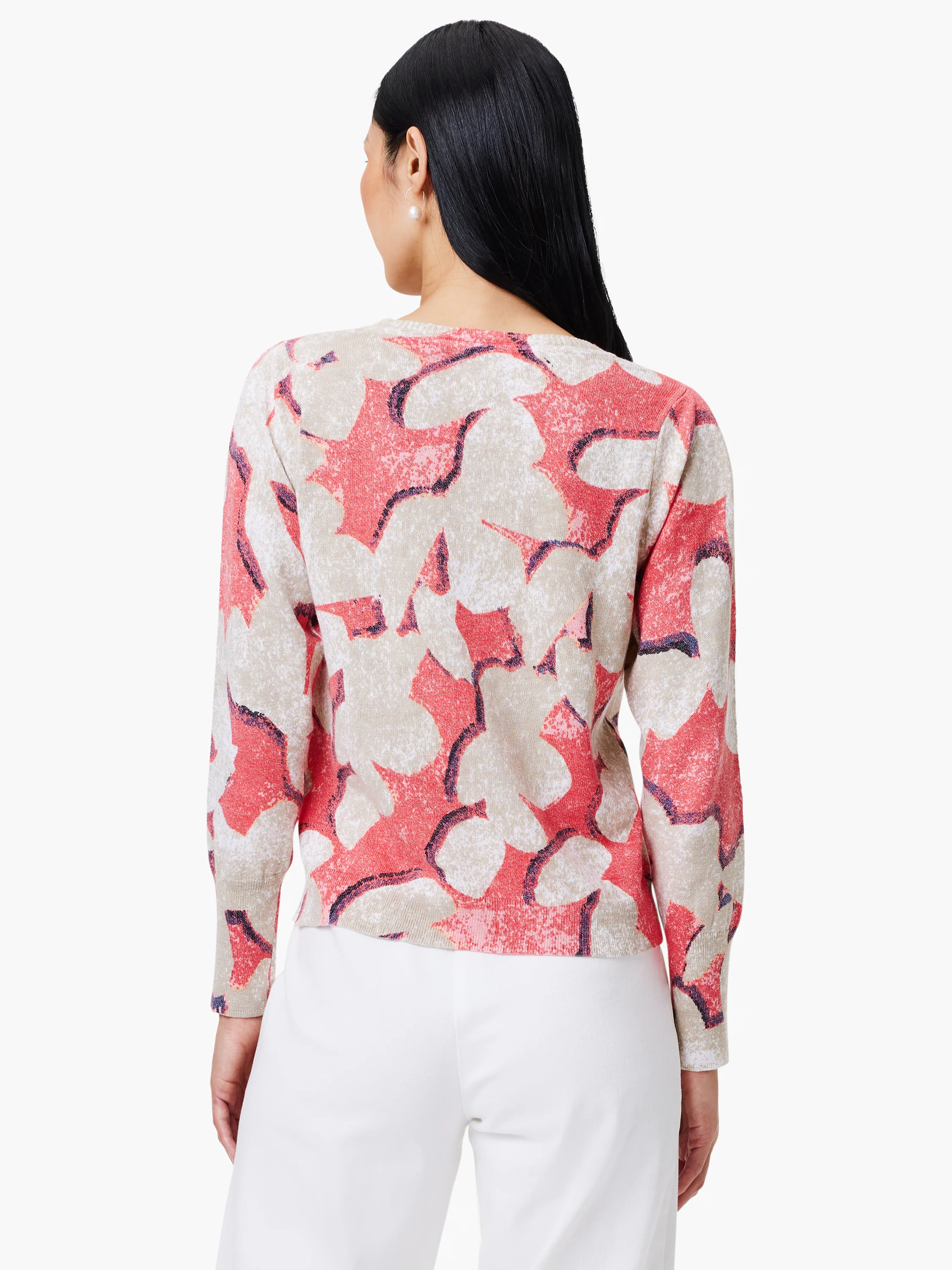 Coral and beige abstract print long-sleeve knit sweater. Back view.