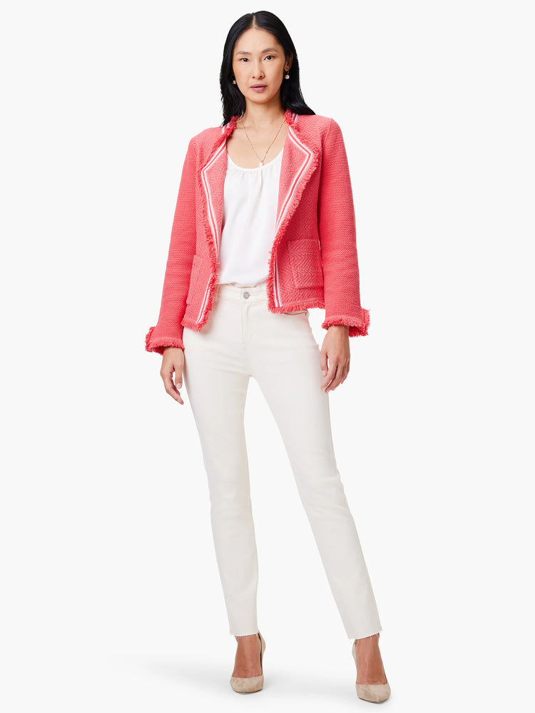 Coral knit jacket with white trim and fringe detail. Short sleeves.