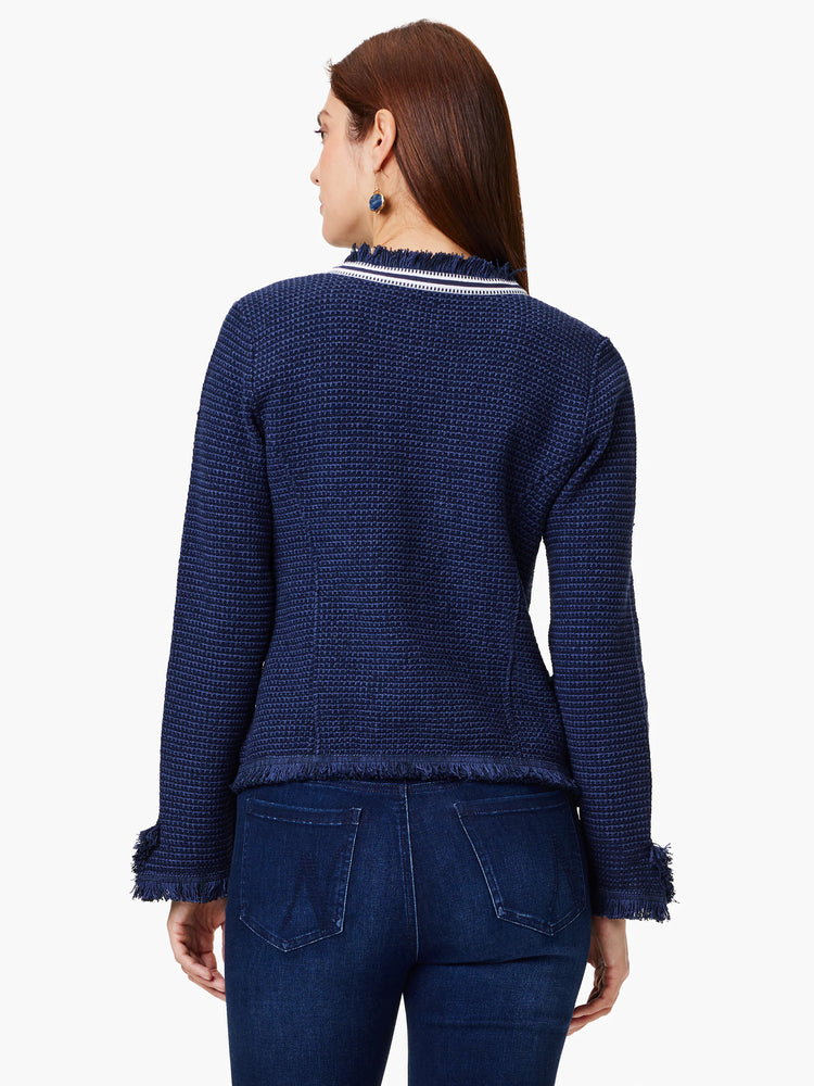 Navy blue knit jacket with white and navy trim, and frayed edges at the hem and sleeves.