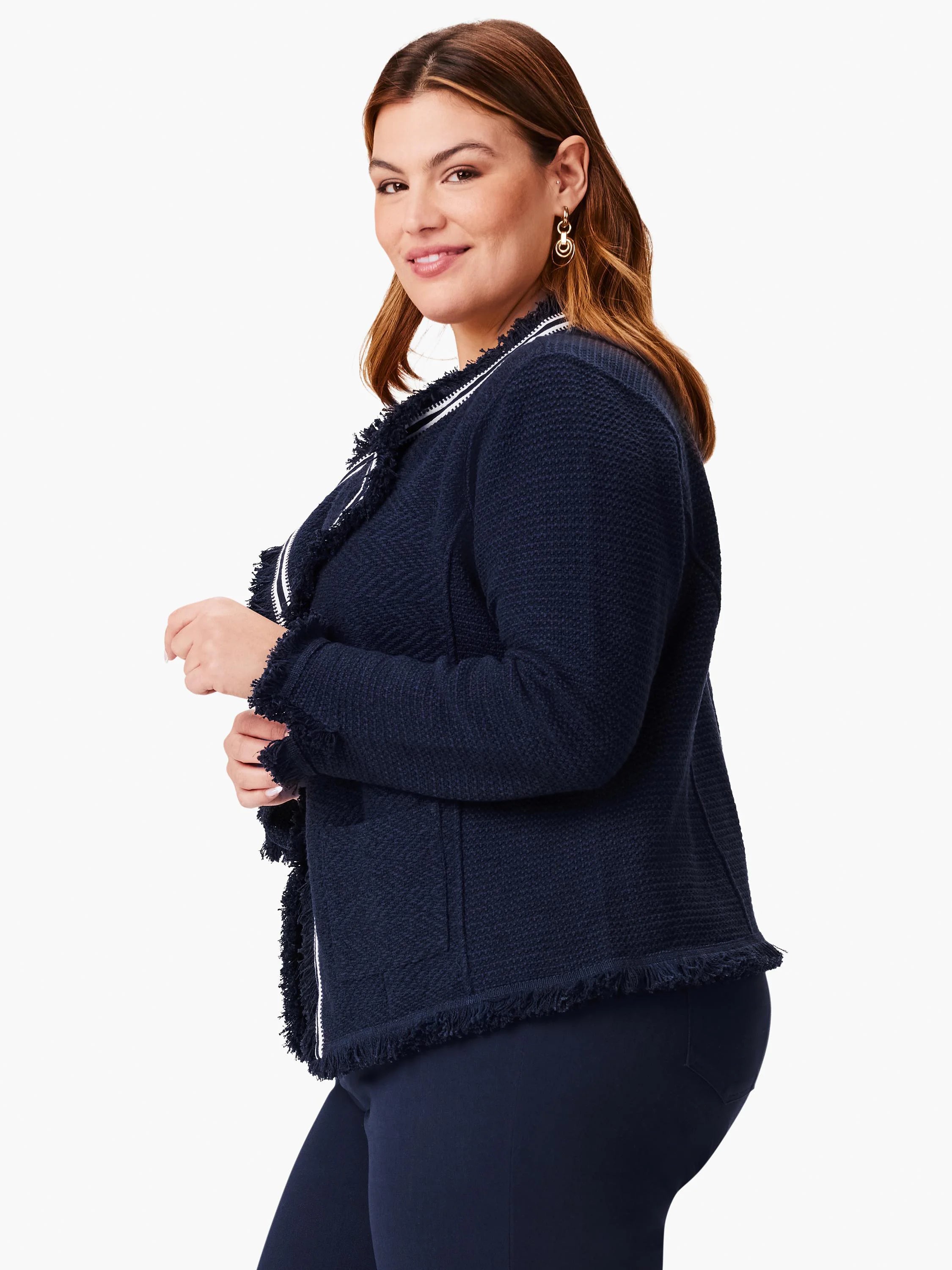 Navy blue knit jacket with white trim and fringe detailing. Long sleeves, zipper front.