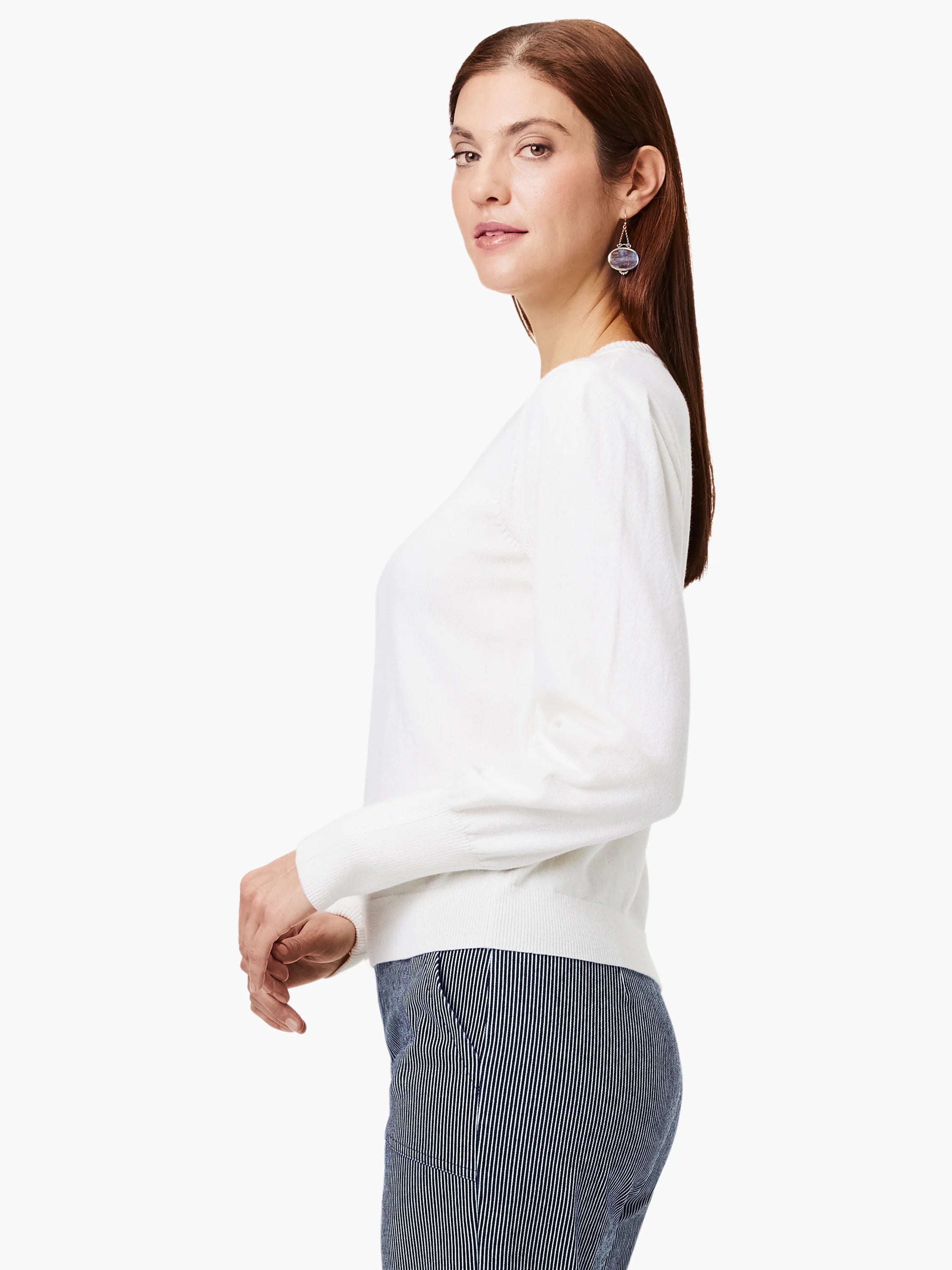 White sweater features gathered sleeves at shoulder, ribbed cuffs and hem.
