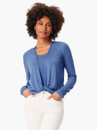 Blue long-sleeve cardigan with a front knot, worn over a blue tank top.
