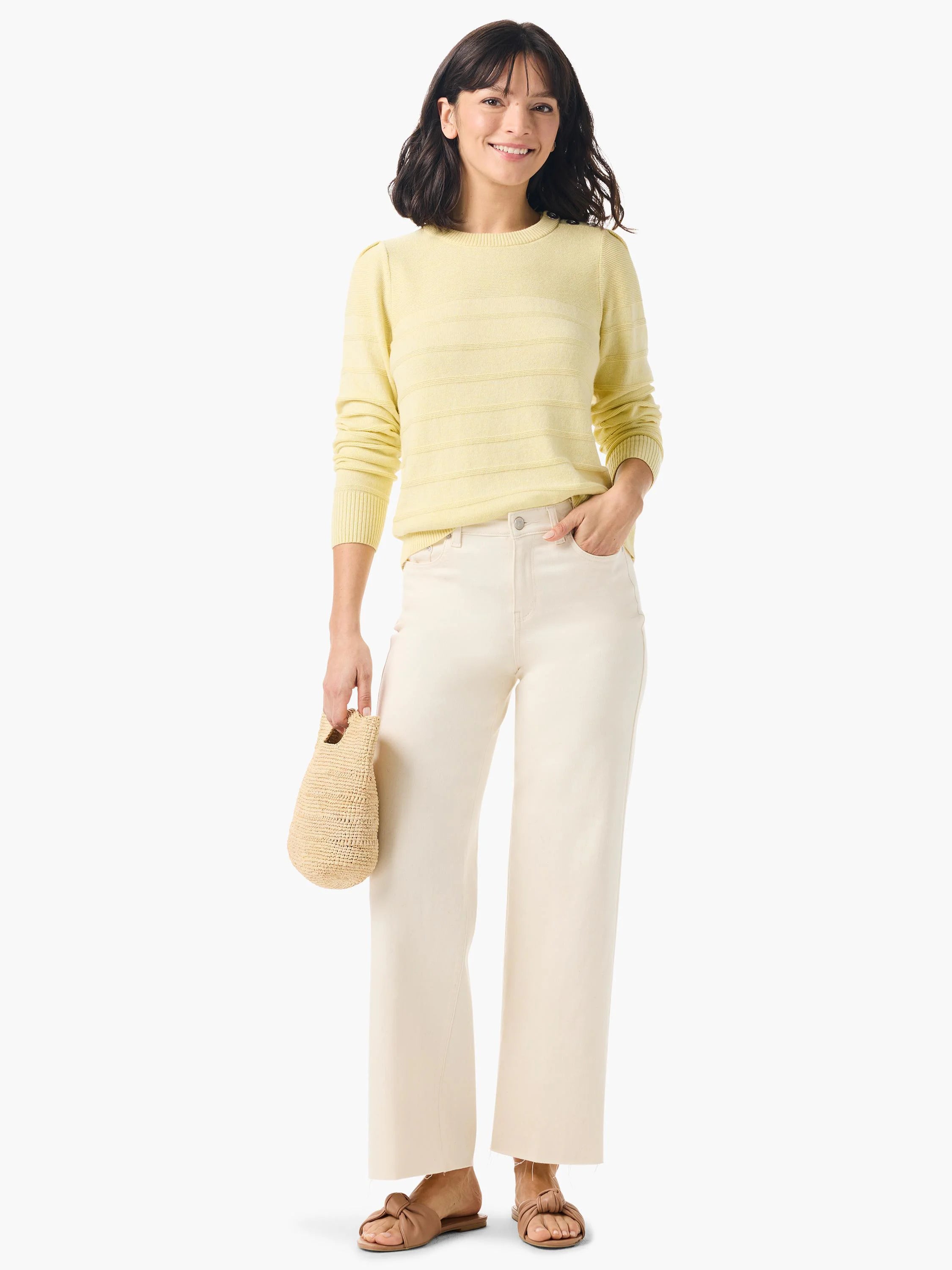 Pale yellow cashmere sweater with subtle horizontal stripes, long sleeves, and button detailing on the shoulders.