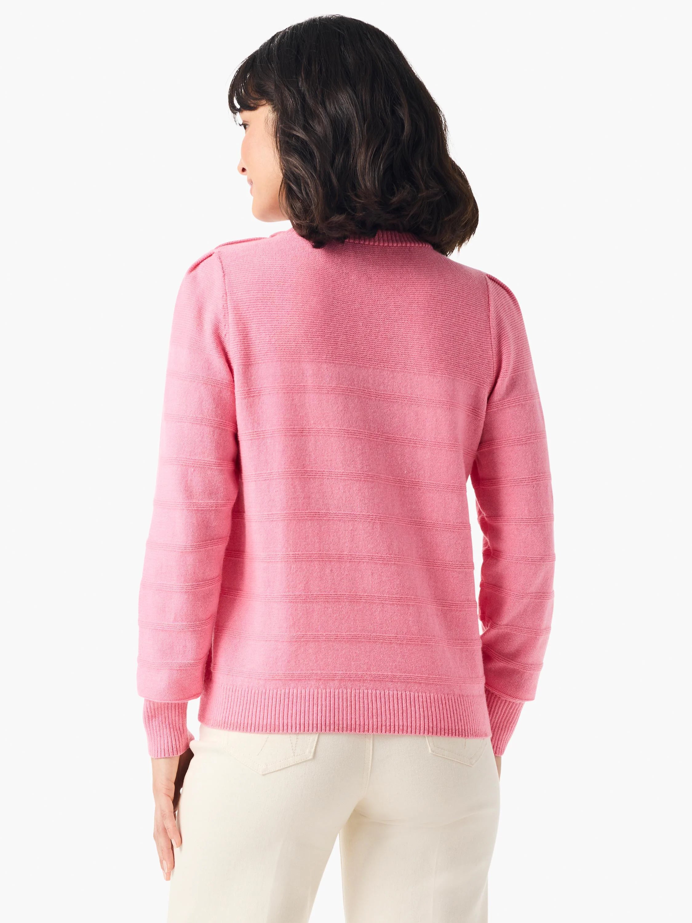 Pink cashmere sweater, rear view. Horizontal ribbed texture. Long sleeves, button detail at shoulders.