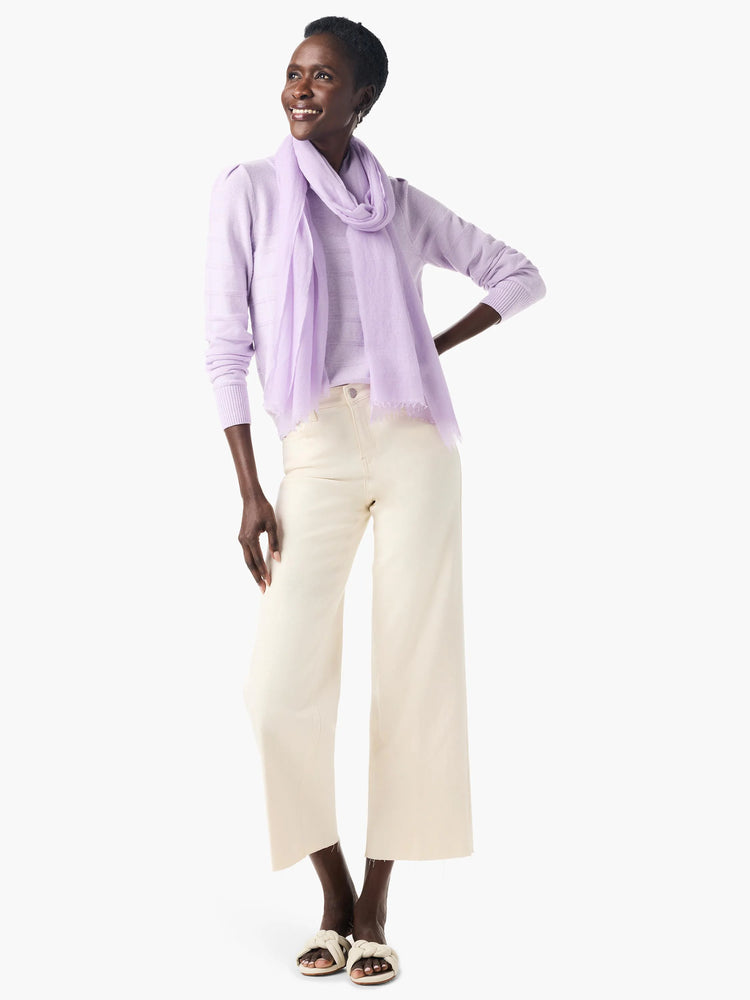 Lilac cashmere sweater with subtle texture, shown with a lilac scarf.