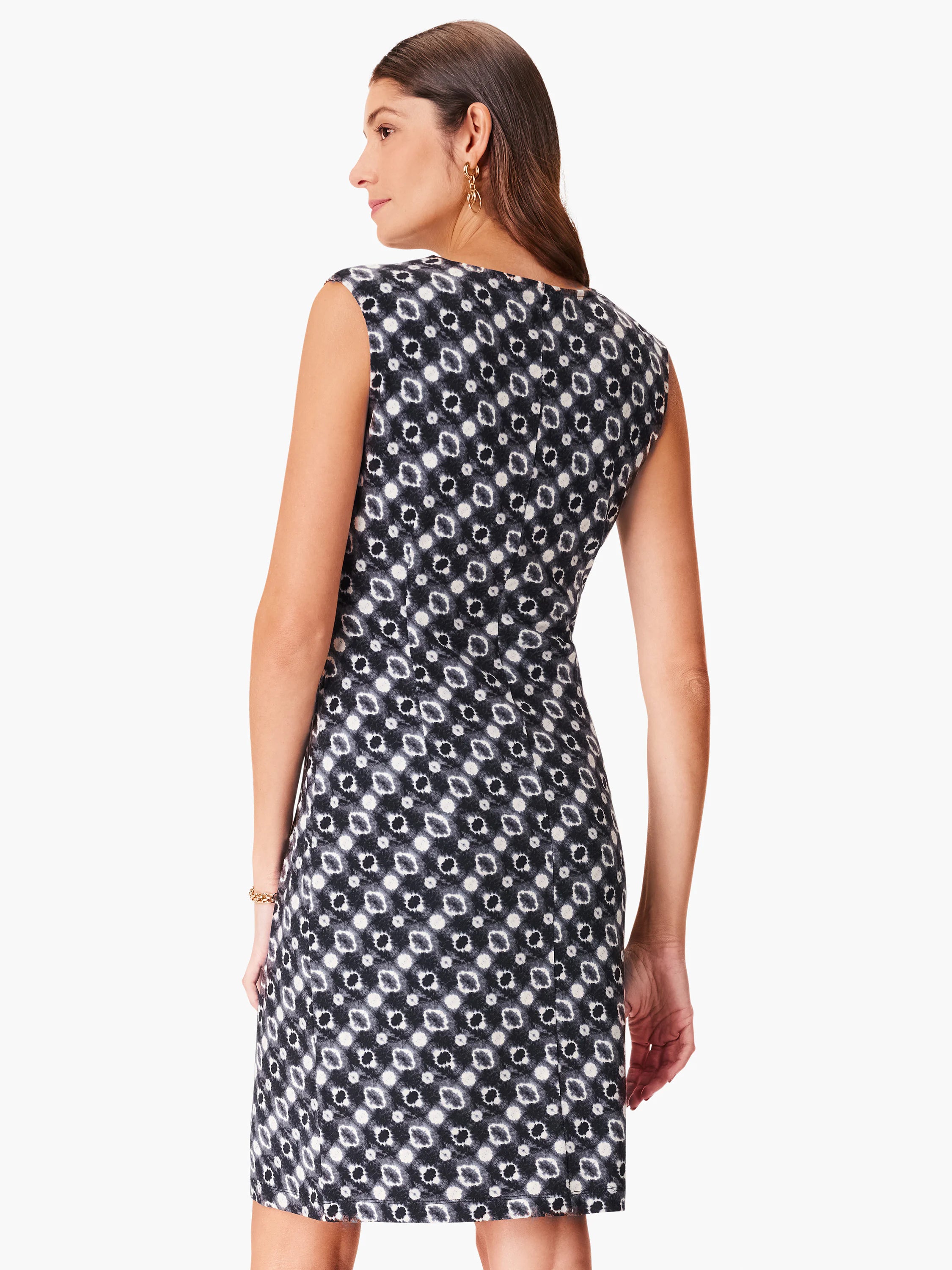 Sleeveless sheath dress, black and off-white repeating pattern. Back view.