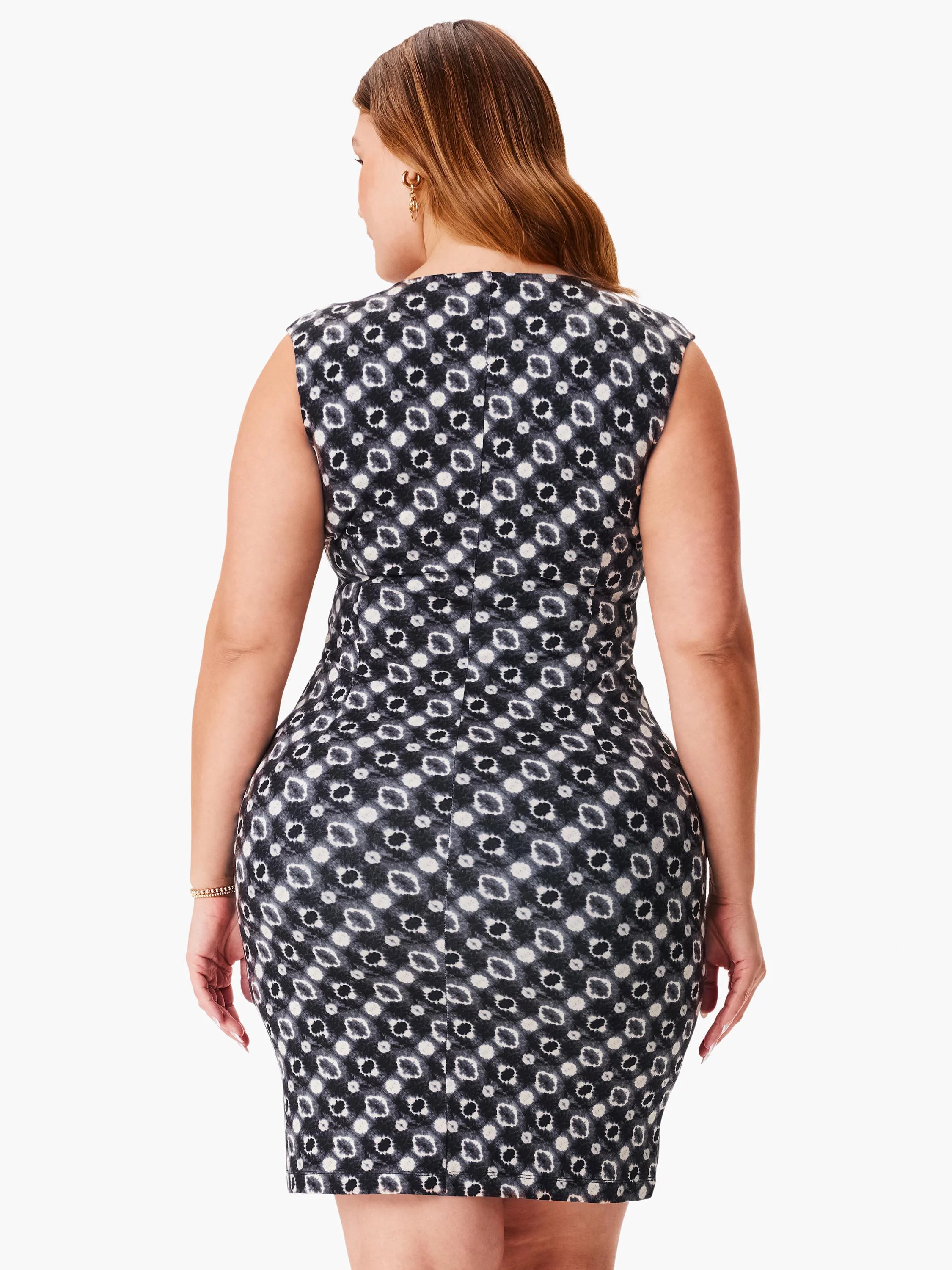 Here's alt text for the image, under 125 characters:
"Black and white sleeveless dress. Small, repeating pattern....
