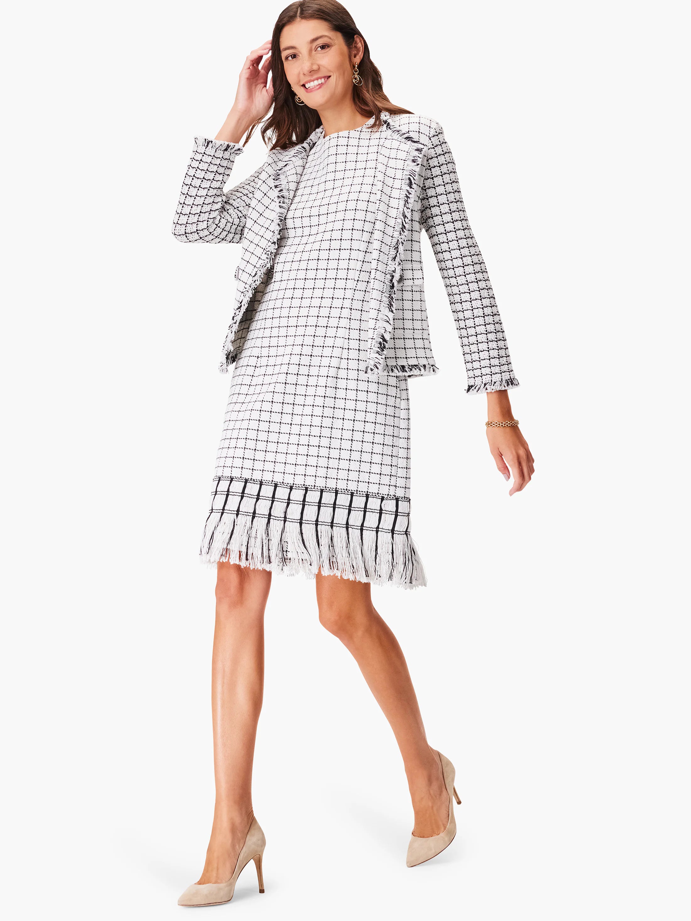 White & black grid pattern dress with fringe trim at hem and jacket.
