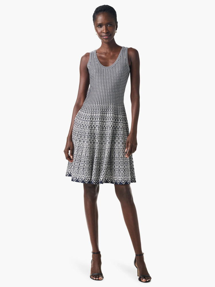 Sleeveless, navy and white geometric patterned fit-and-flare dress. The pattern is predominantly vertical stripes with a...