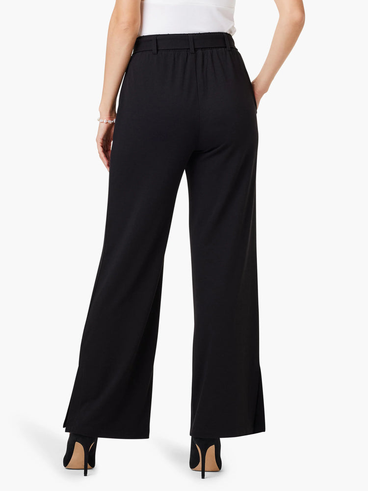 Black wide-leg pants with side slits, elasticized waistband. Rear view.