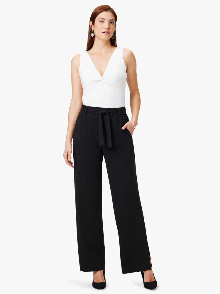 Black wide-leg pants with a self-tie belt; side slits at hem.
