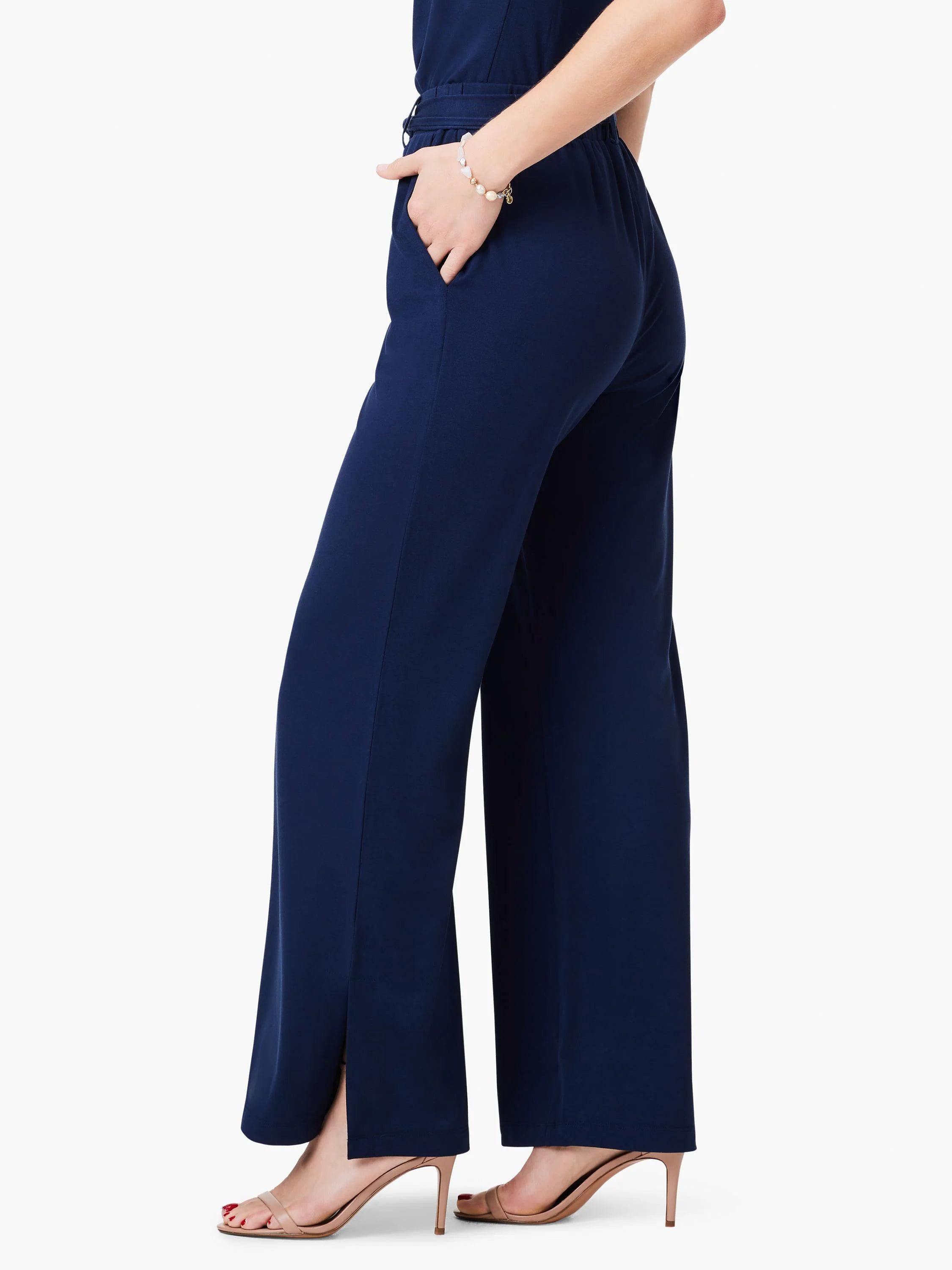 Navy blue wide-leg pants; side slits at hem. Model wears nude heels.