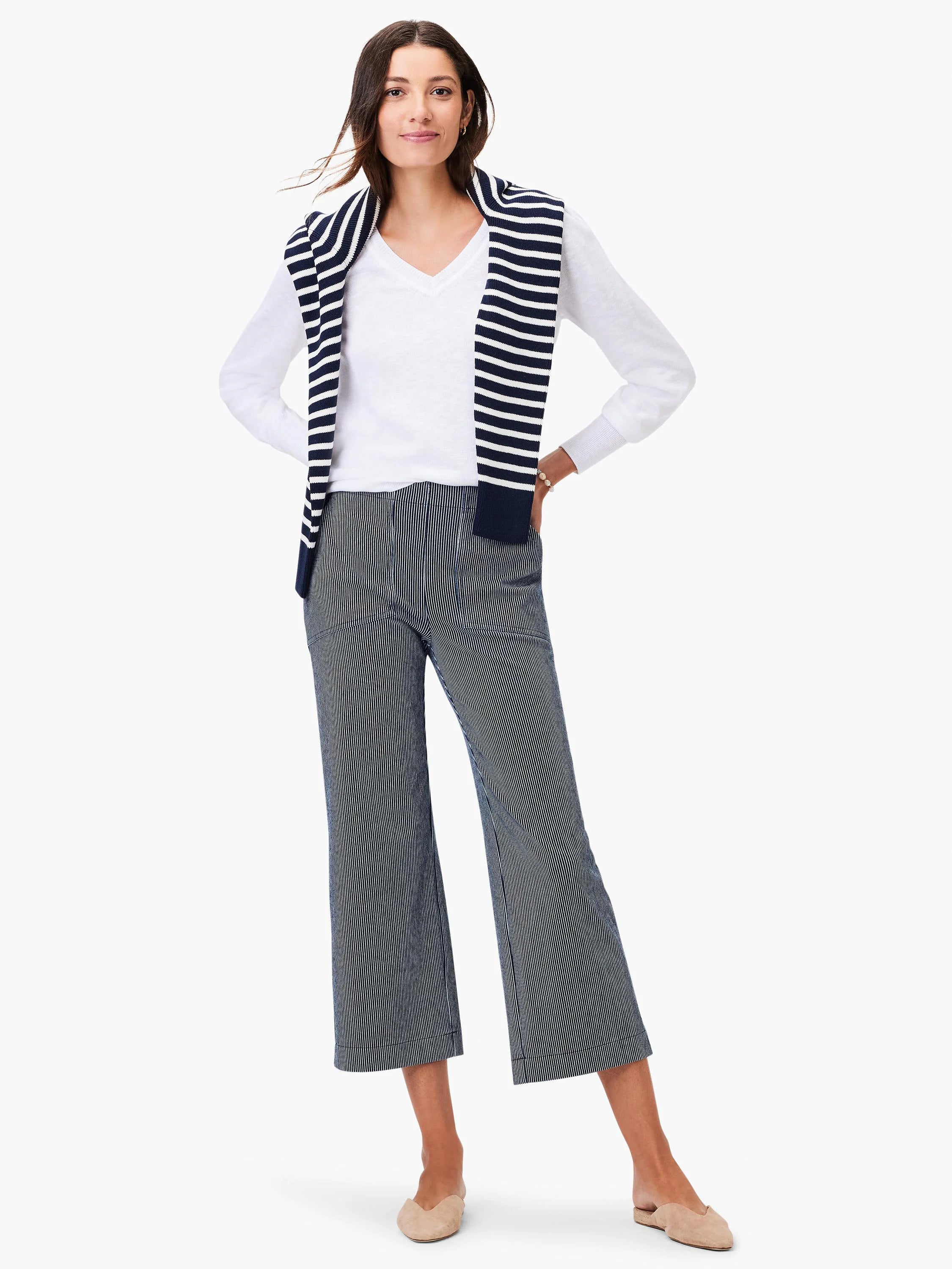 Cropped wide-leg jeans with fine vertical navy and white stripes.