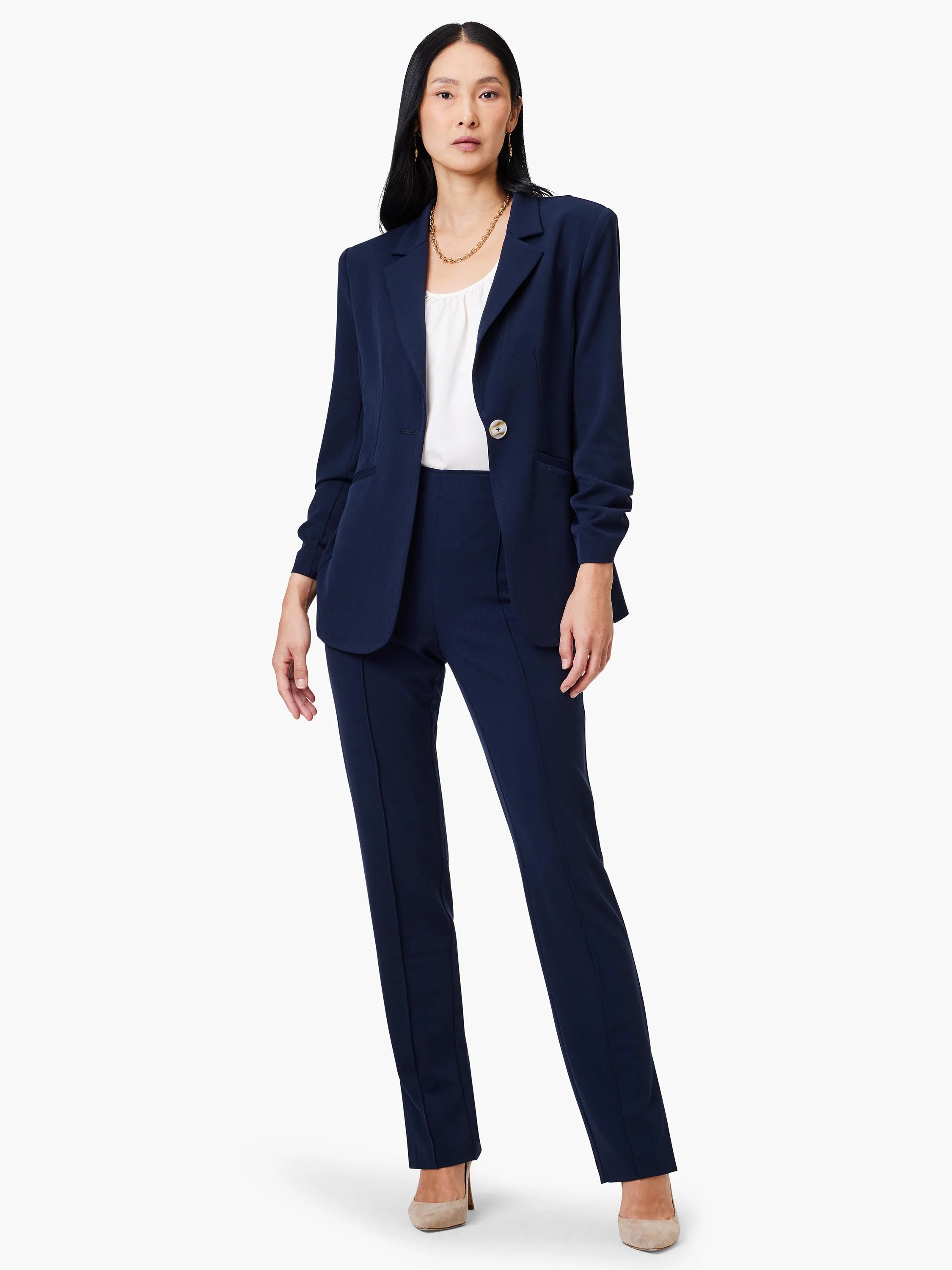Navy blue blazer, single button, scrunch sleeves. Model also wears navy pants.