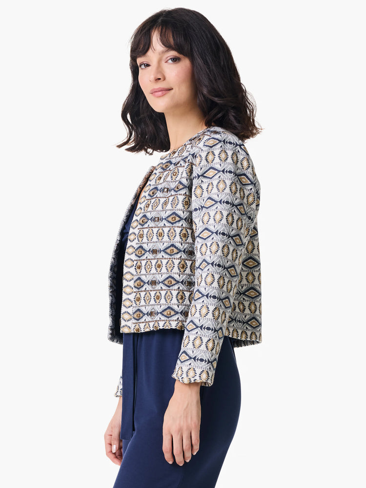 Off-white jacket with navy and gold geometric pattern, embellished with beads. Short sleeves.