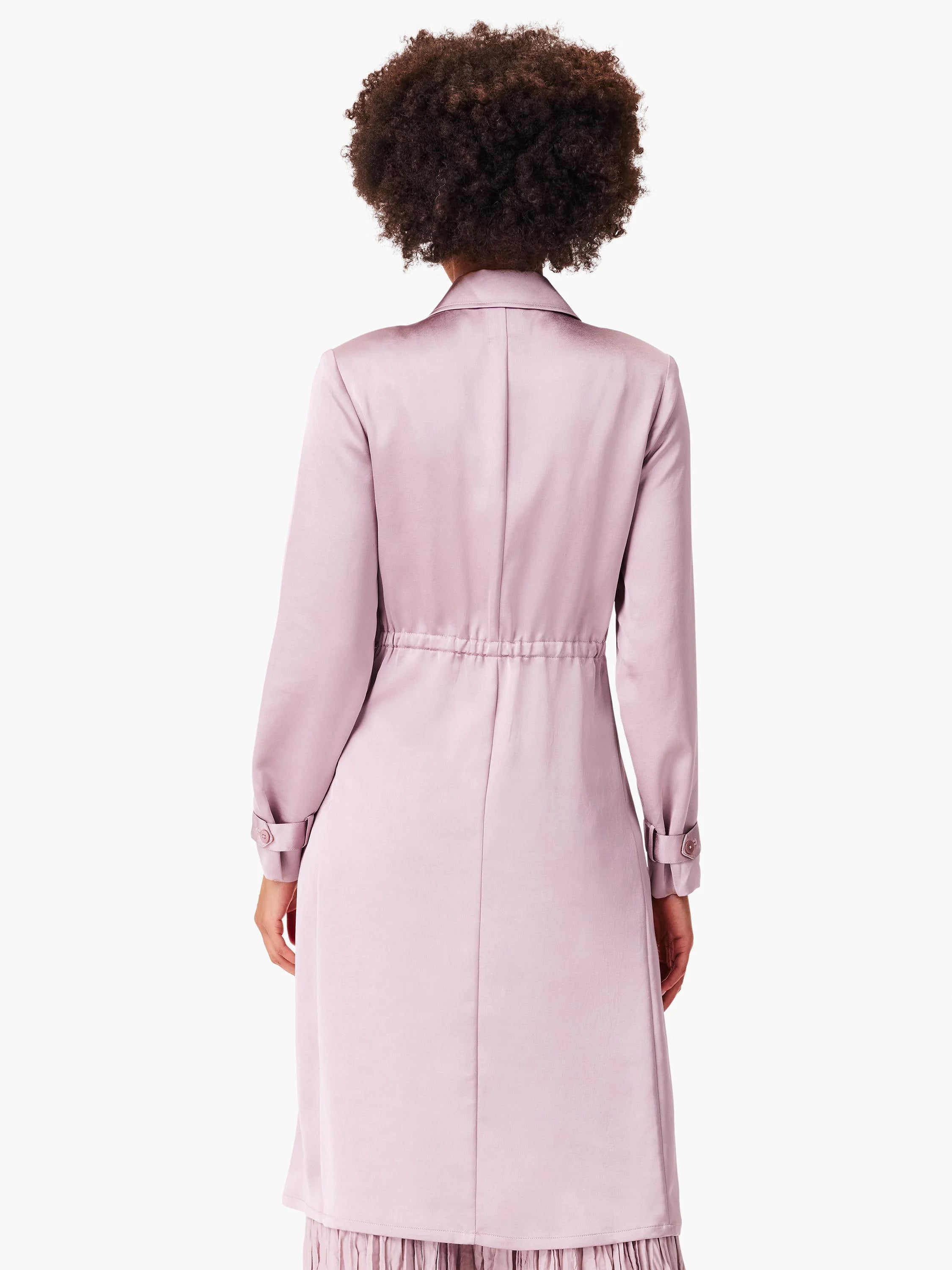 Lilac satin trench coat, long sleeves, cinched waist, and a slight ruffle at the hem.