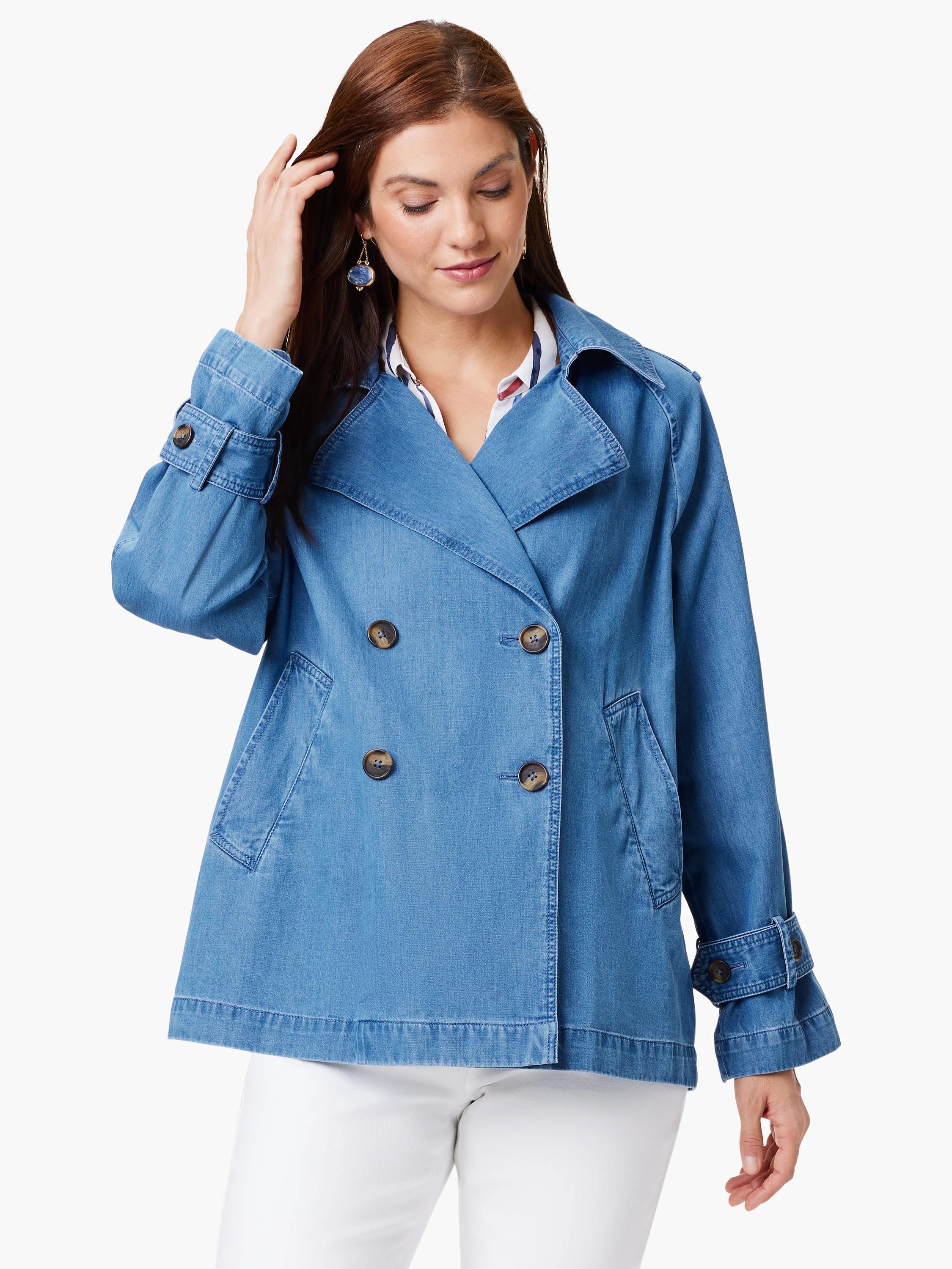 Light blue denim trench coat, double-breasted, with dark buttons and flap pockets. The coat is hip-length.