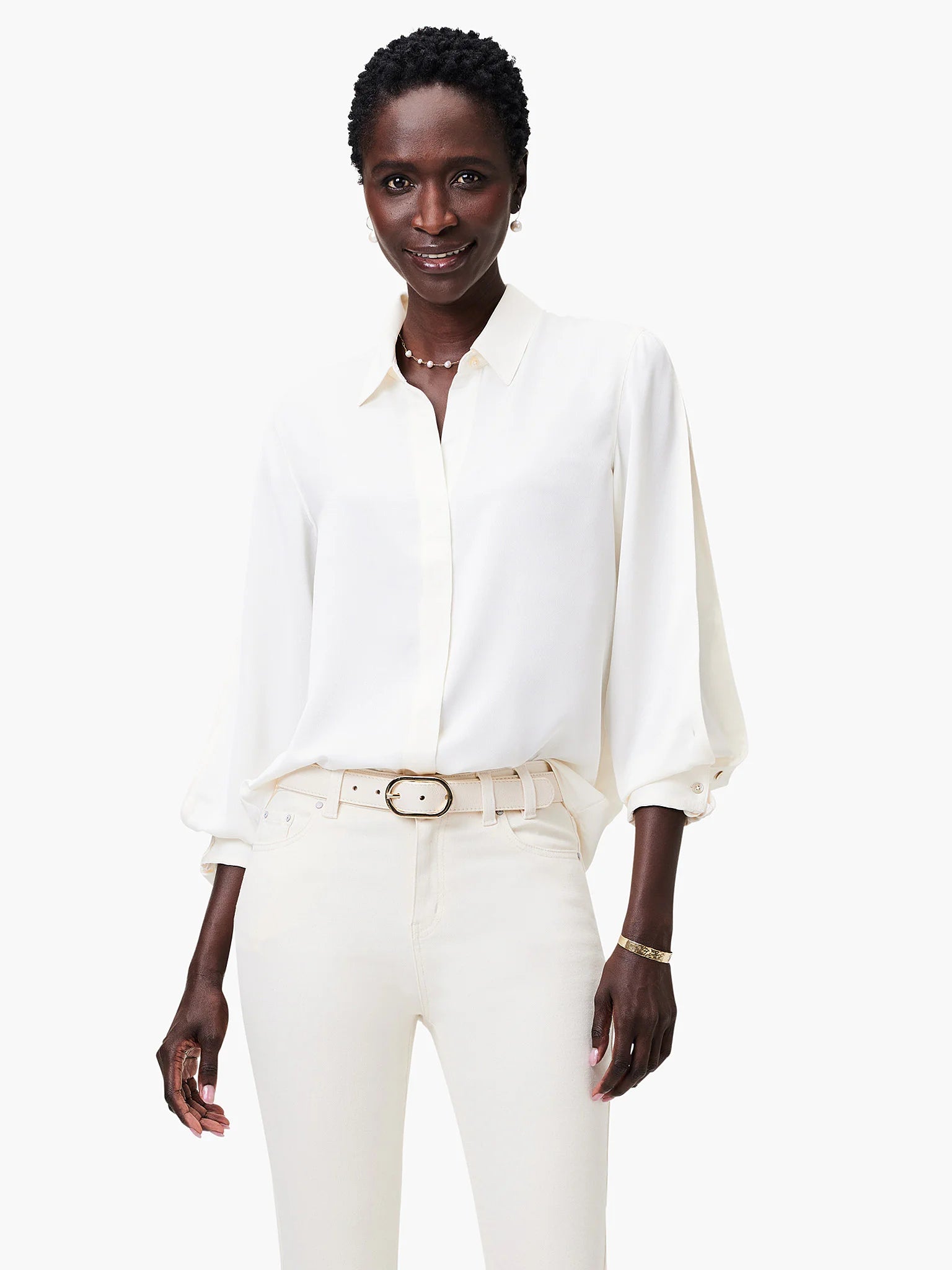 Off-white satin chiffon shirt; long sleeves with slight puff at shoulder; button-front closure.