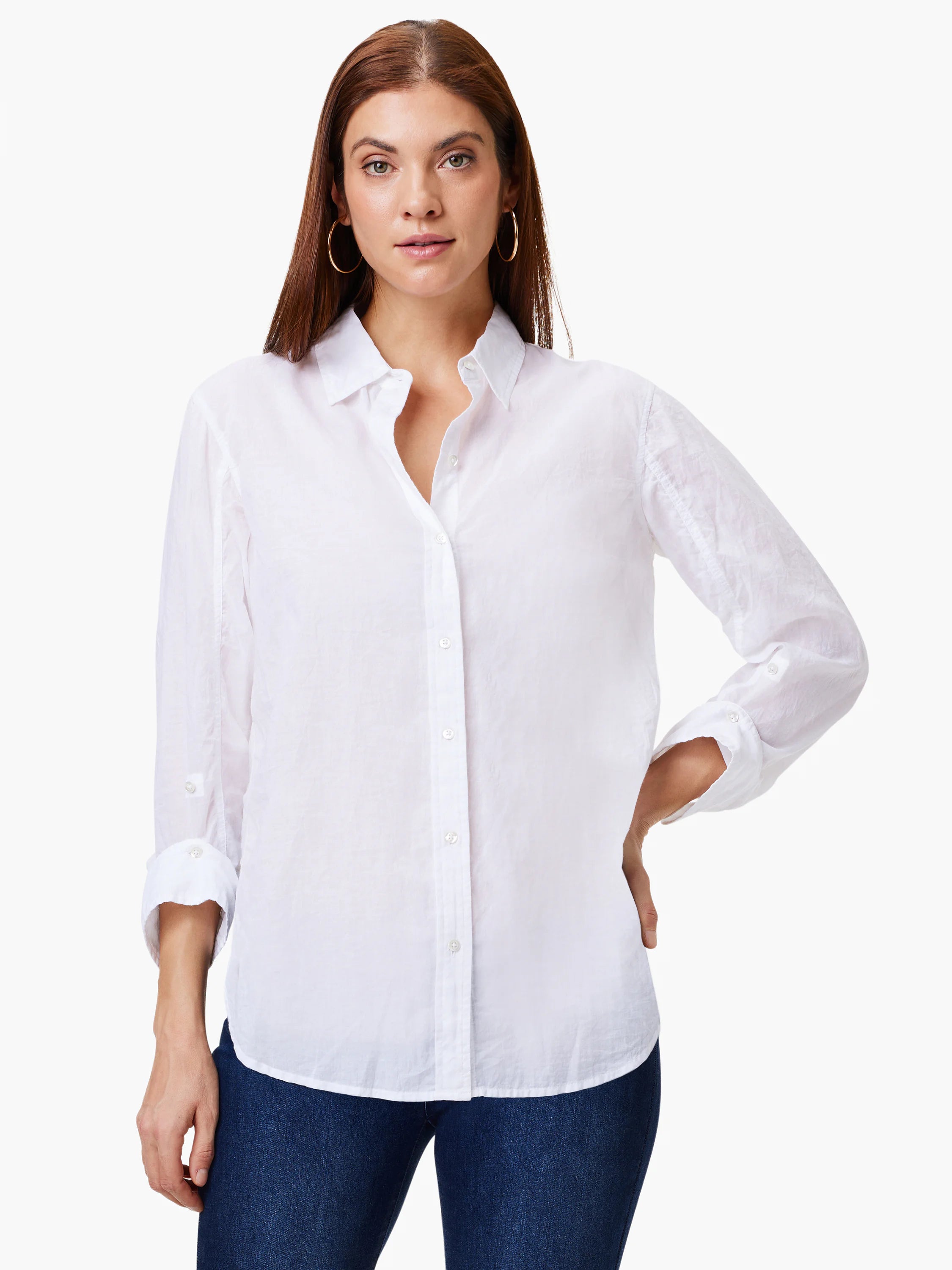 White cotton collared shirt with button-down front, long sleeves rolled up and secured. Relaxed fit.