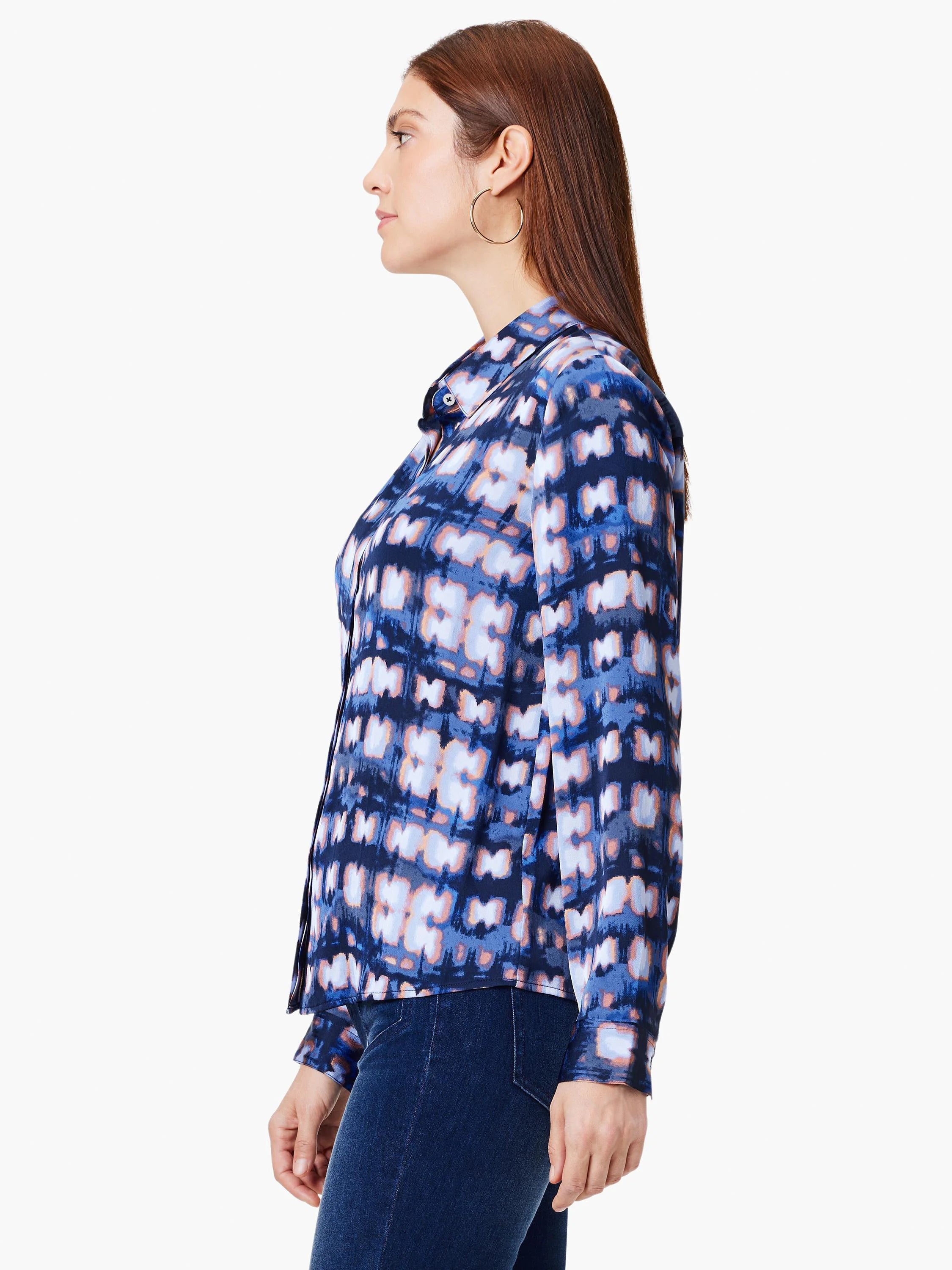 Long-sleeve button-up shirt. Dark blue, light blue, and peach abstract print on a silky-looking fabric.
