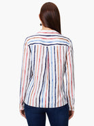 White long-sleeve top with vertical painted stripes in blue, pink, brown, and grey, seen from the back.