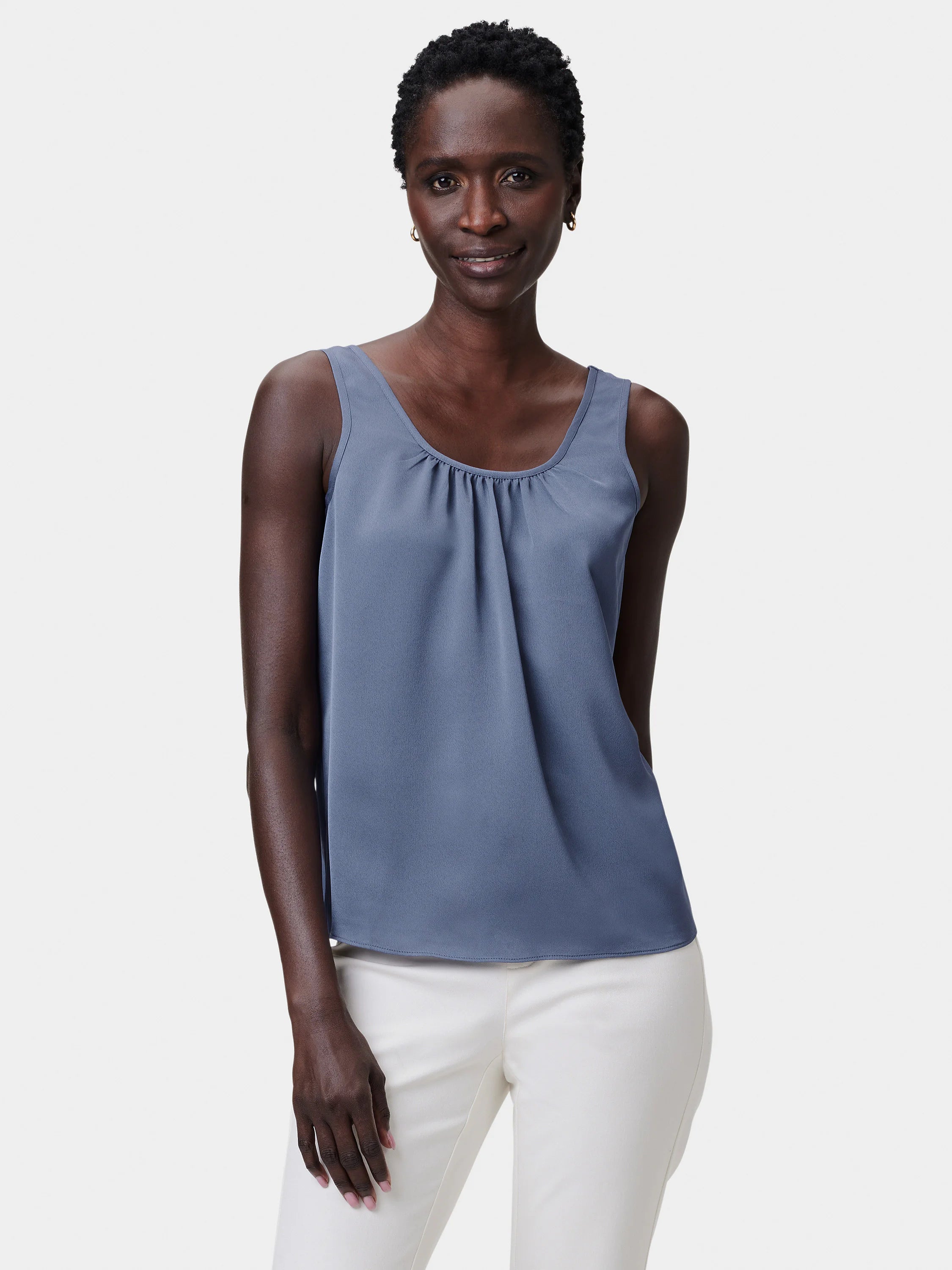 Slate blue tank with scoop neck and gathers at the front neckline. Loose, flowy fit.