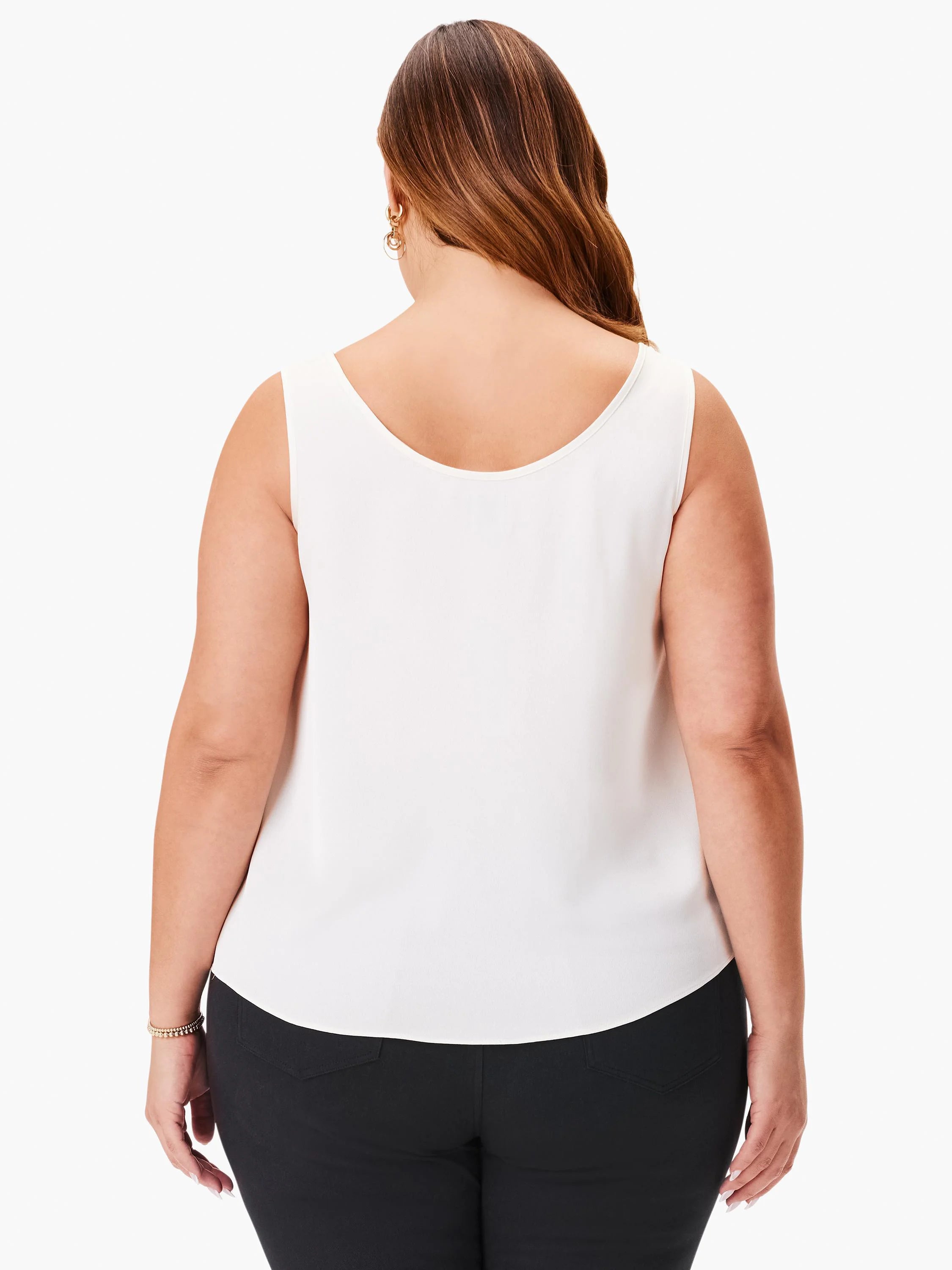 Off-white sleeveless tank with scoop back neckline. Model seen from behind.