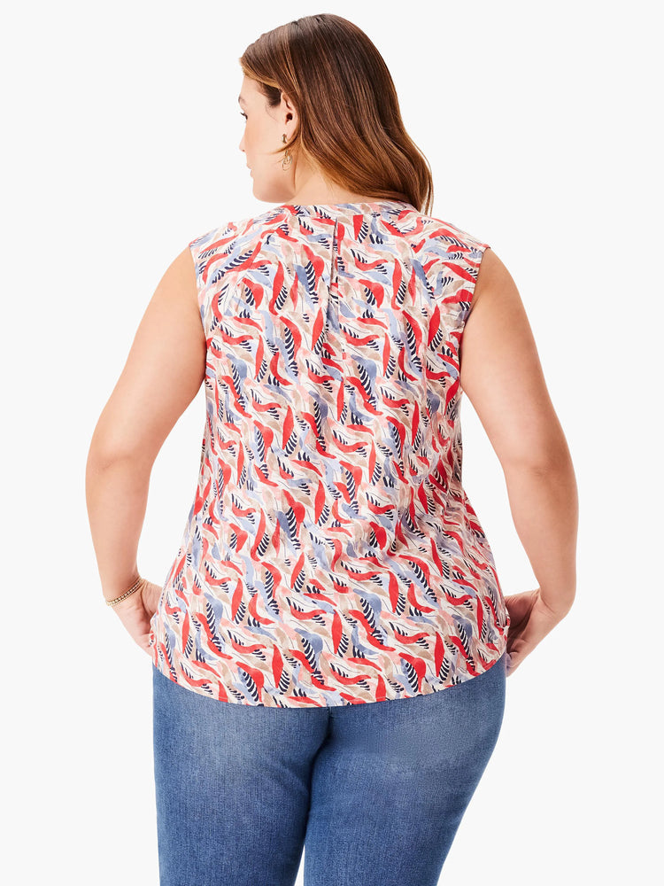 Sleeveless top, off-white background with red, blue, and taupe abstract leaf print. Back view.