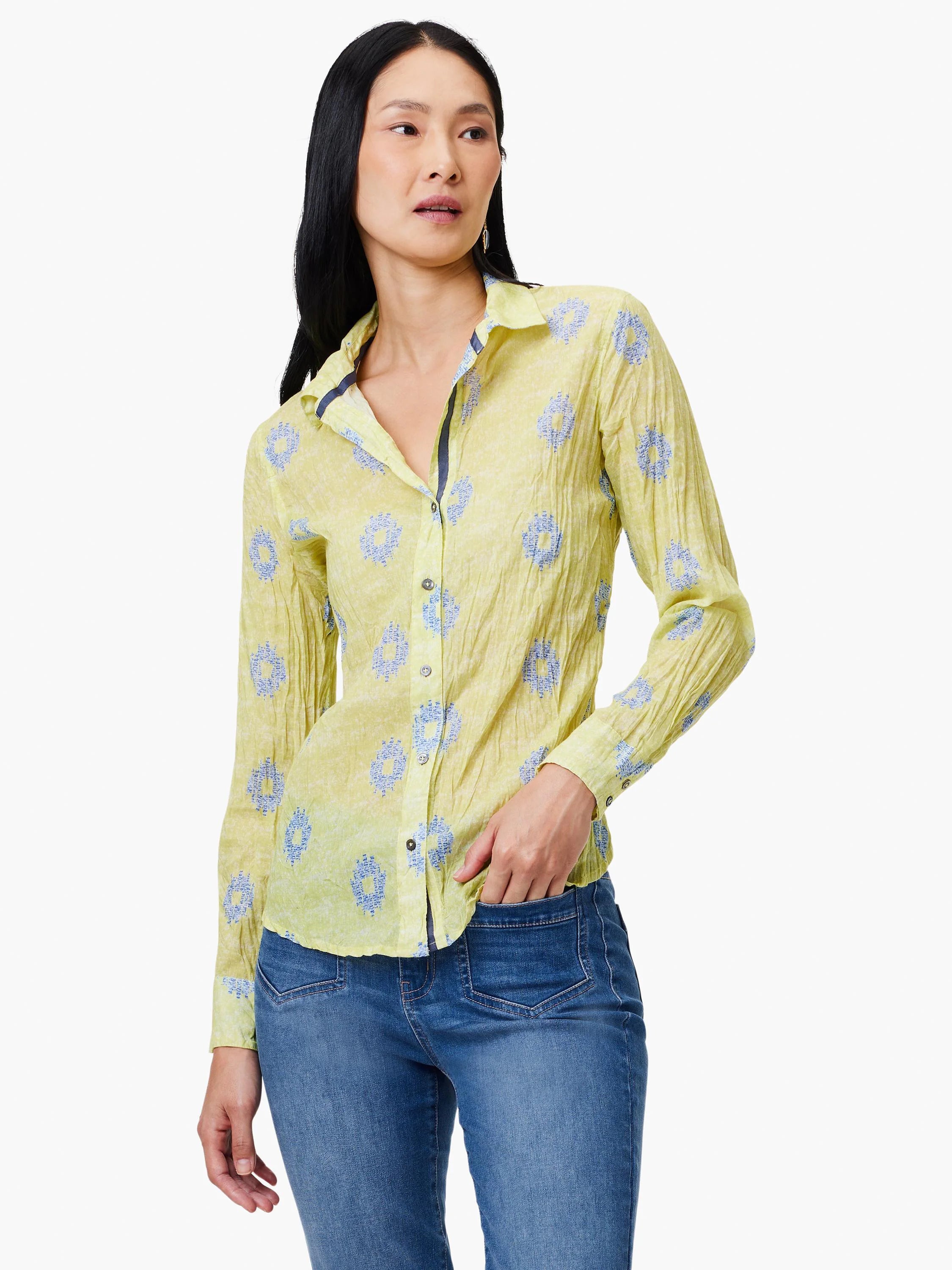 Pale yellow long-sleeve button-down shirt with a crinkled texture and small blue floral pattern.