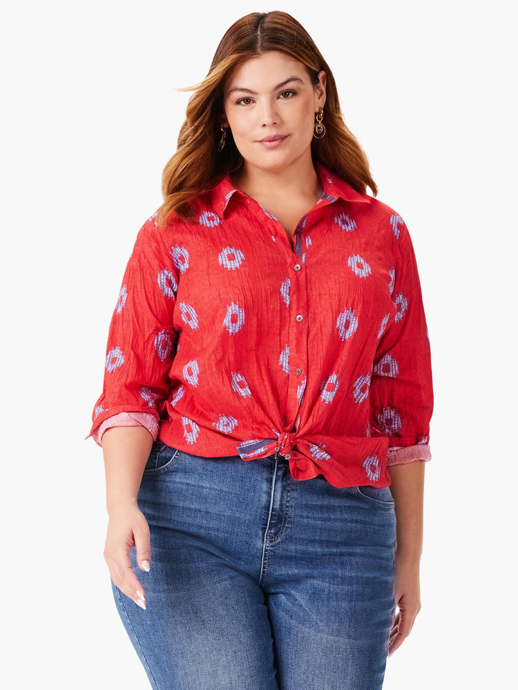 Red button-down shirt with a crinkled texture and a light blue geometric pattern. Long sleeves.