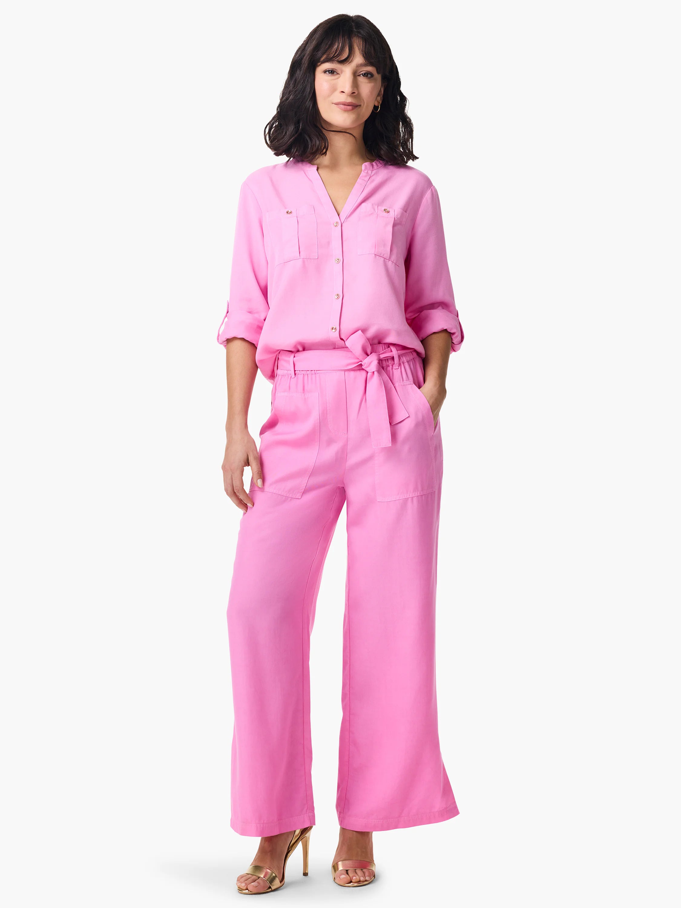 Pink shirt, button-down, elbow-length sleeves, and two chest pockets. Matching pink wide-leg pants with a tie belt and...