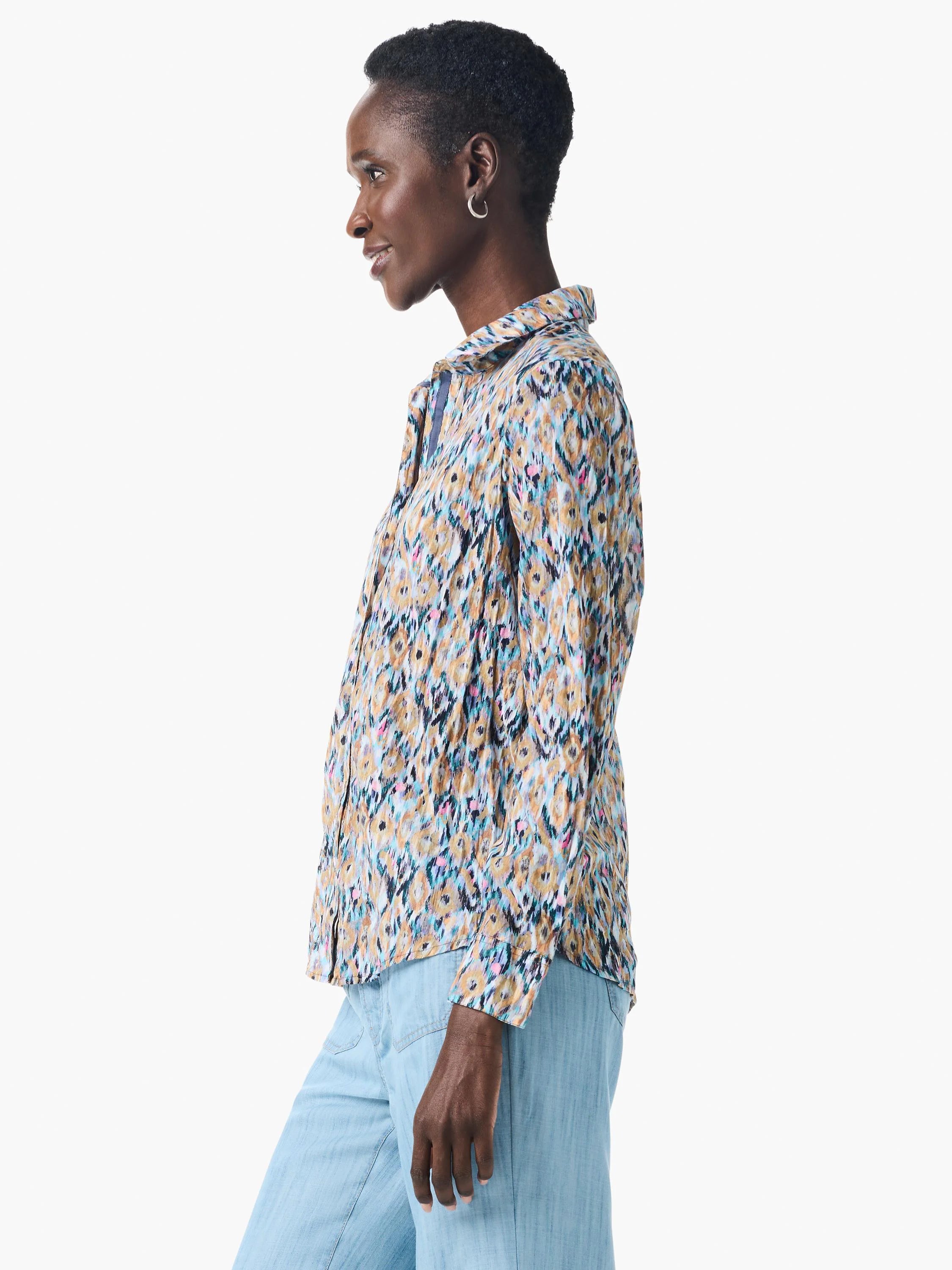 Long-sleeve collared shirt. Blue, tan, & pink abstract print on crinkled fabric.