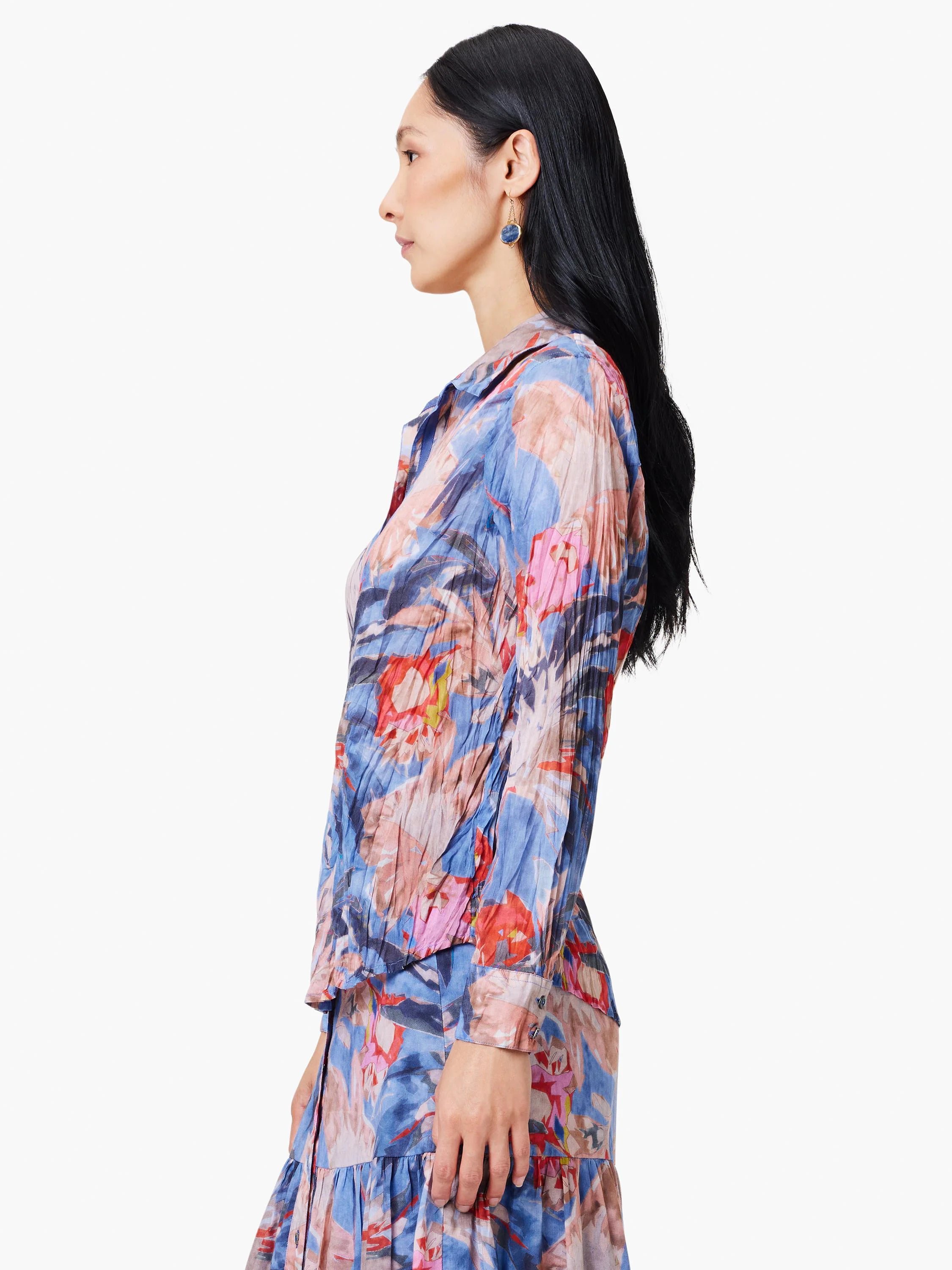 Blue, pink, and red abstract floral print long-sleeve collared shirt. Crinkled texture.