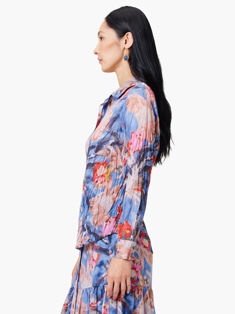 Blue, pink, and red abstract floral print long-sleeve collared shirt. Crinkled texture.