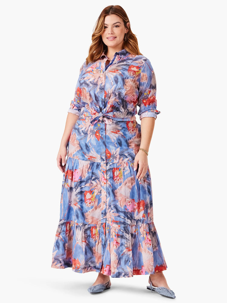 Blue crinkle shirt and maxi skirt. Abstract floral print in blue, pink, and red hues. Shirt is button-down, belted at...