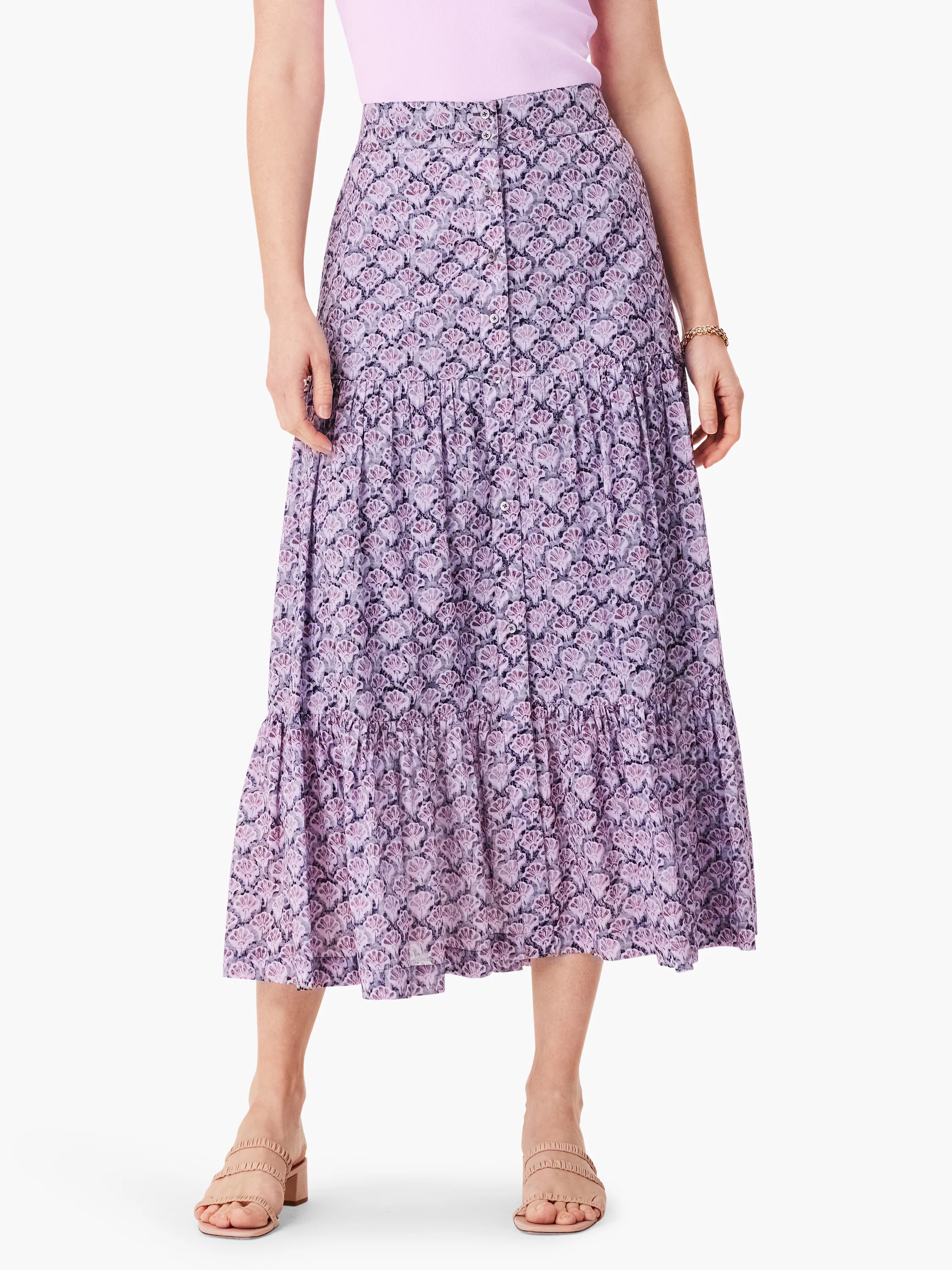 Lilac midi skirt with a dark purple floral print, tiered ruffle details, and button front.
