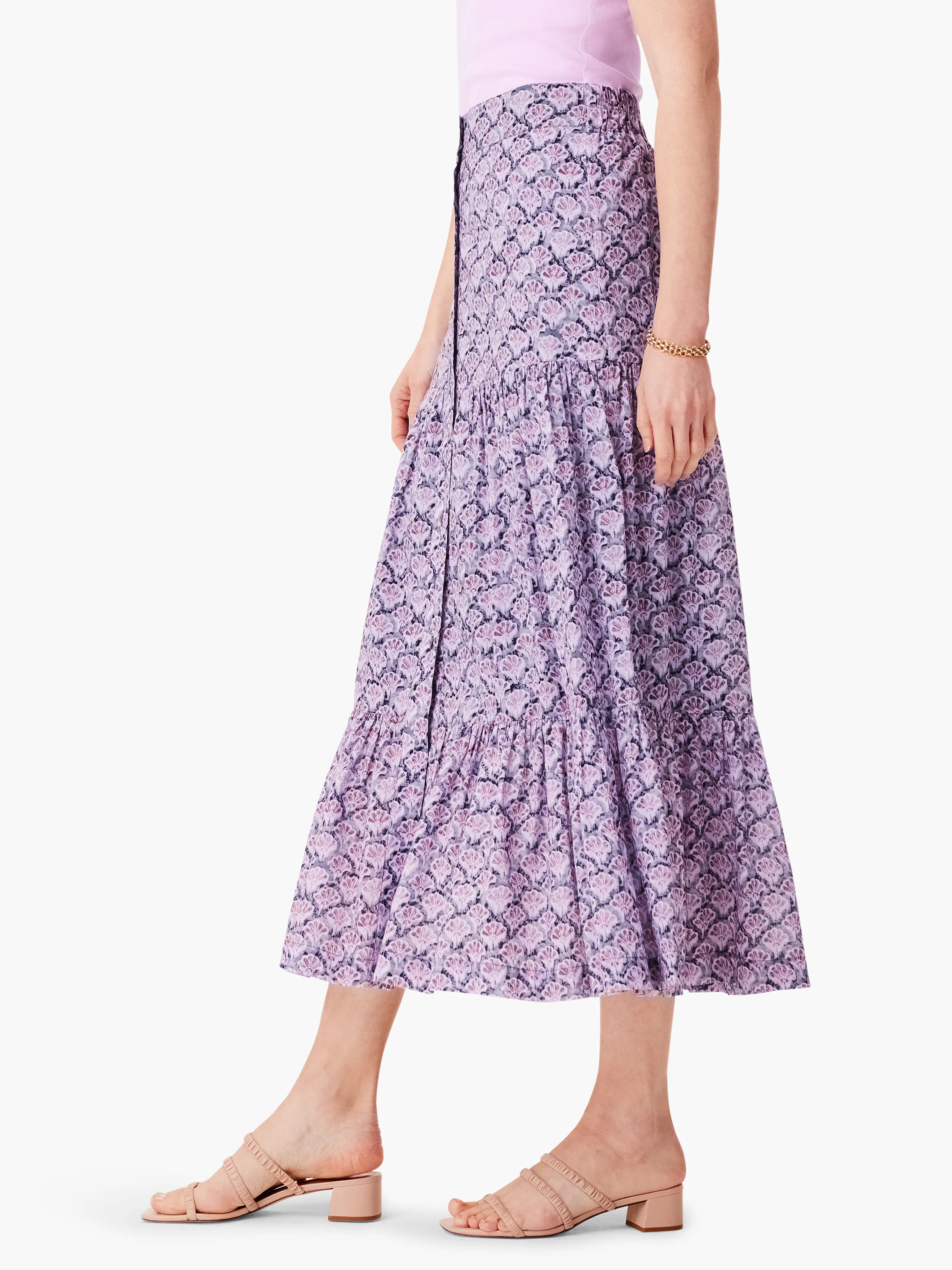 Lilac midi skirt with tiered ruffle and a dark purple floral print. Button front.