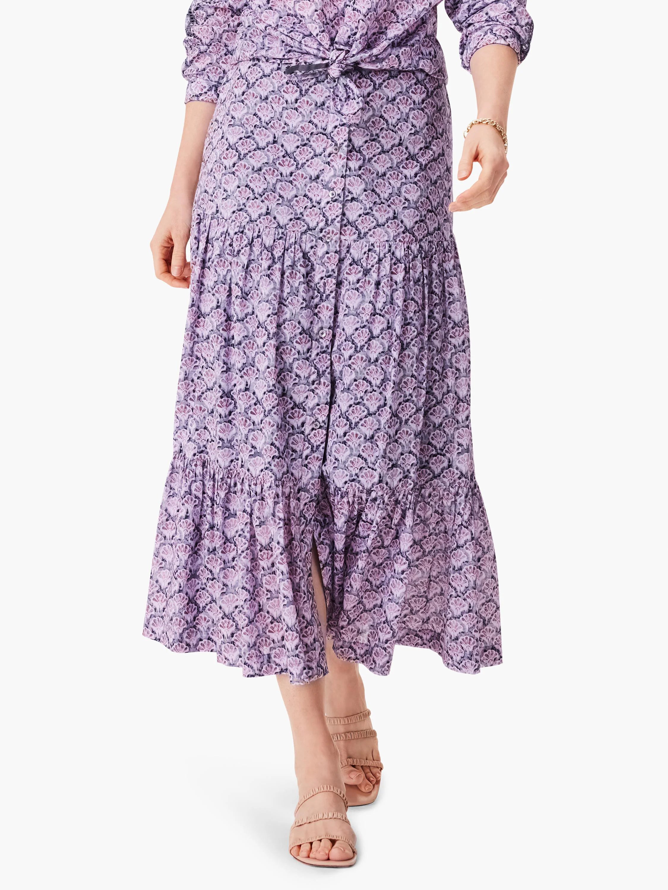 Lilac tiered midi skirt with a dark purple floral print. A front slit is visible.
