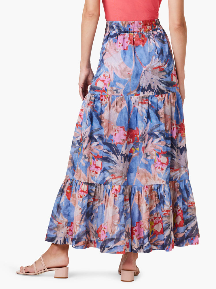 Blue tiered maxi skirt with red, pink, and gray floral print. Elastic waistband.